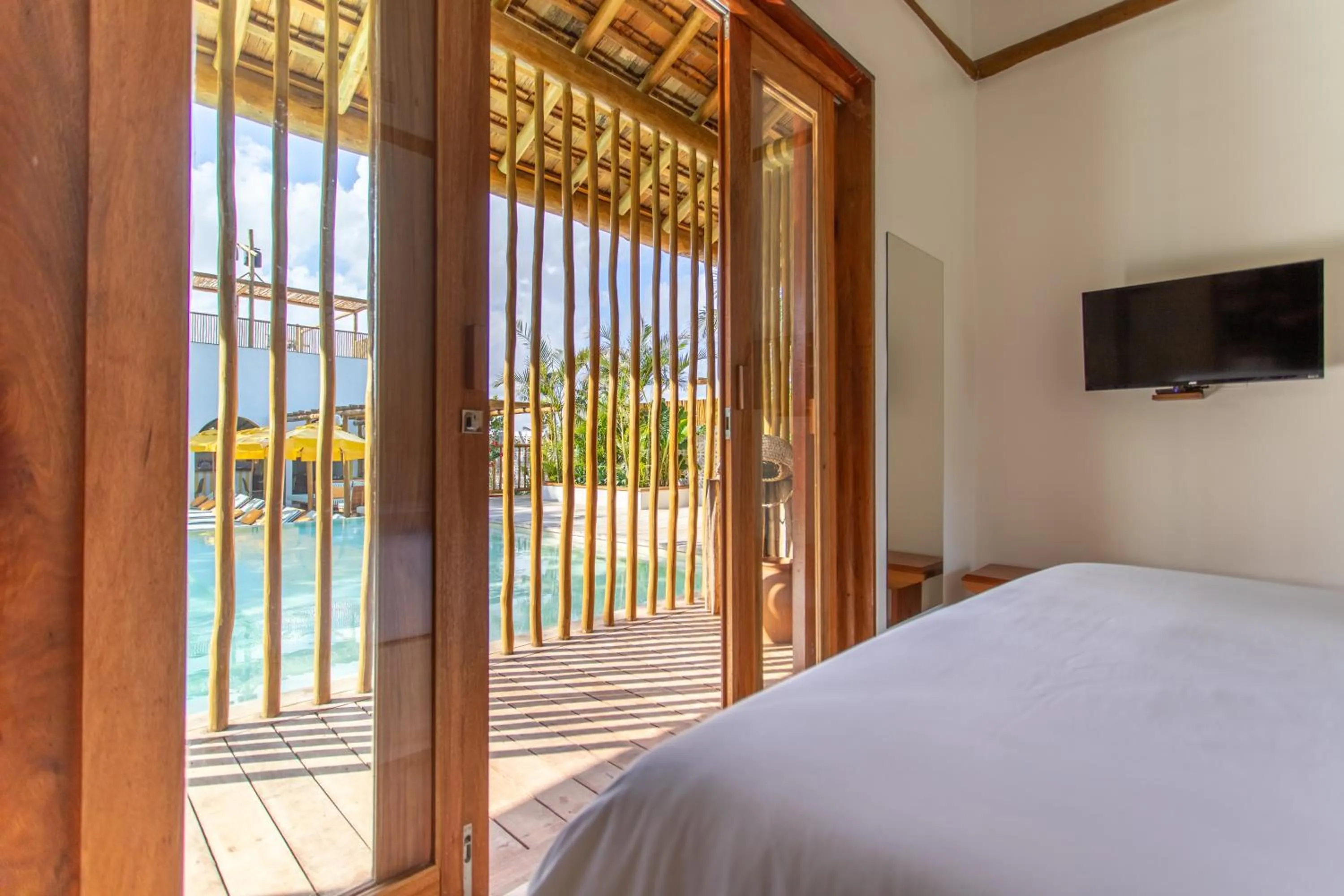 Communal lounge/ TV room, Bed in Café Jeri Hotel - Adults Only