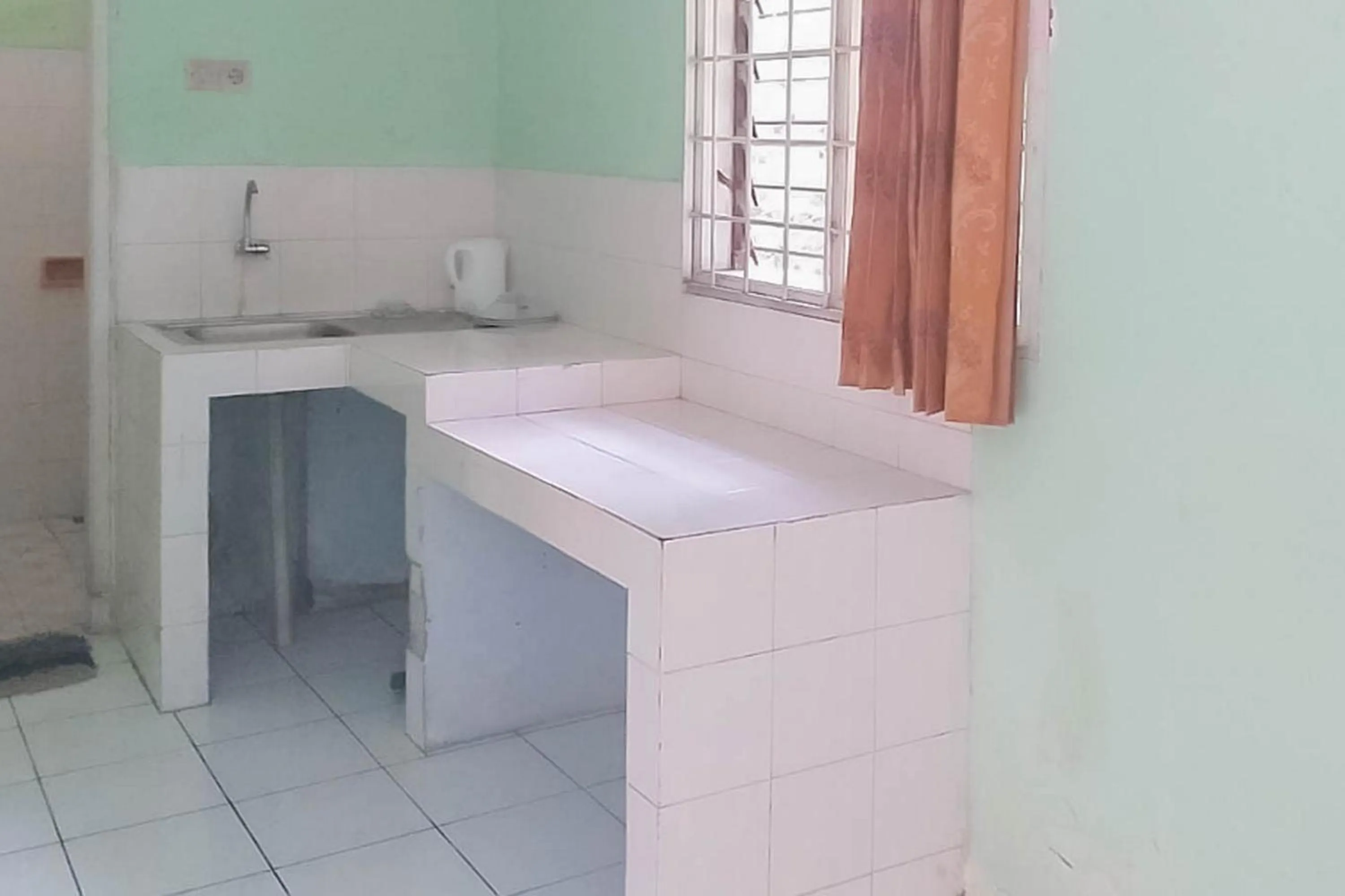 Kitchen or kitchenette in Villa Getsemani Mitra RedDoorz