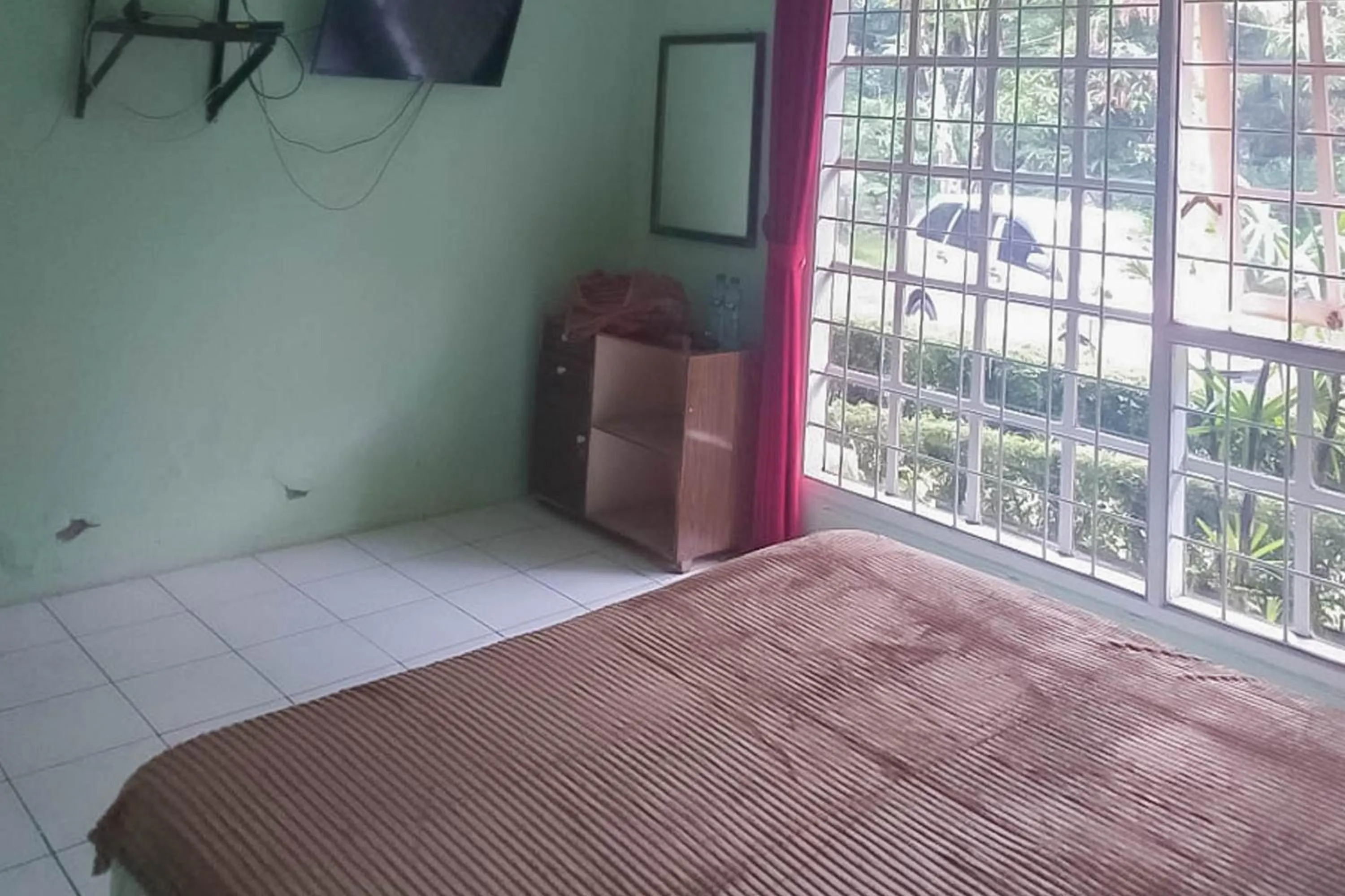 Bed in Villa Getsemani Mitra RedDoorz