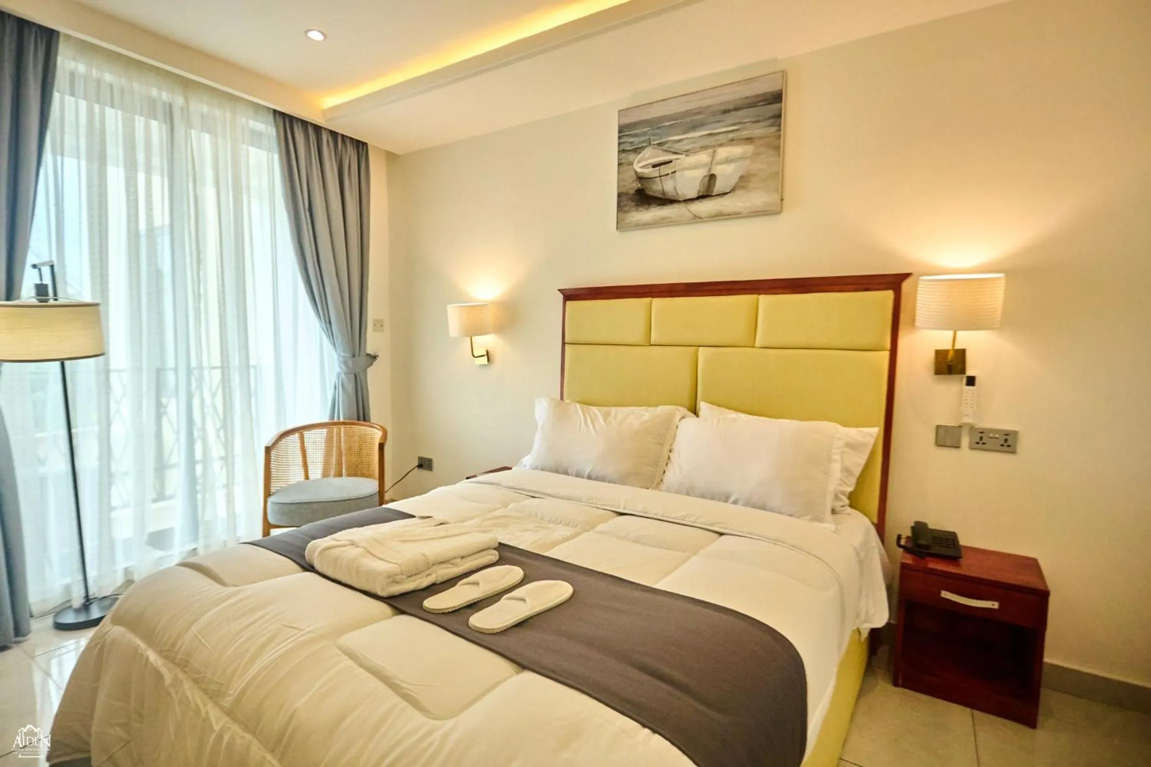 Bed in AIDEN HOMES AND APARTMENTS HOTEl