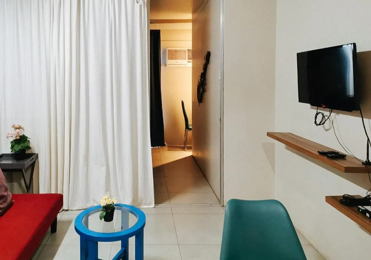 Bedroom, TV/Entertainment Center in GMRENTALS Apartment at Mactan Airport