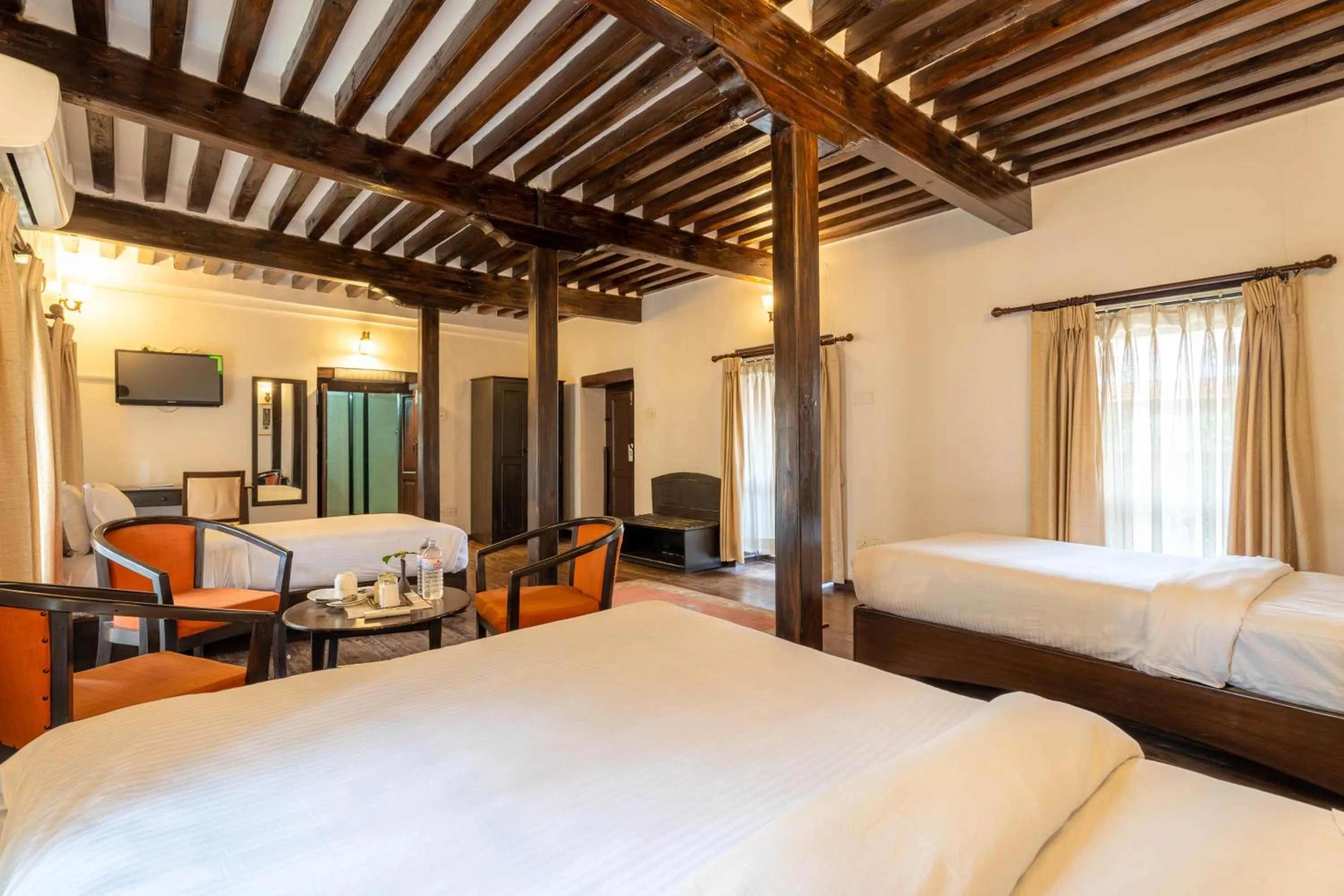 Photo of the whole room, Bed in Hukum Darbar Restaurant & Hotel