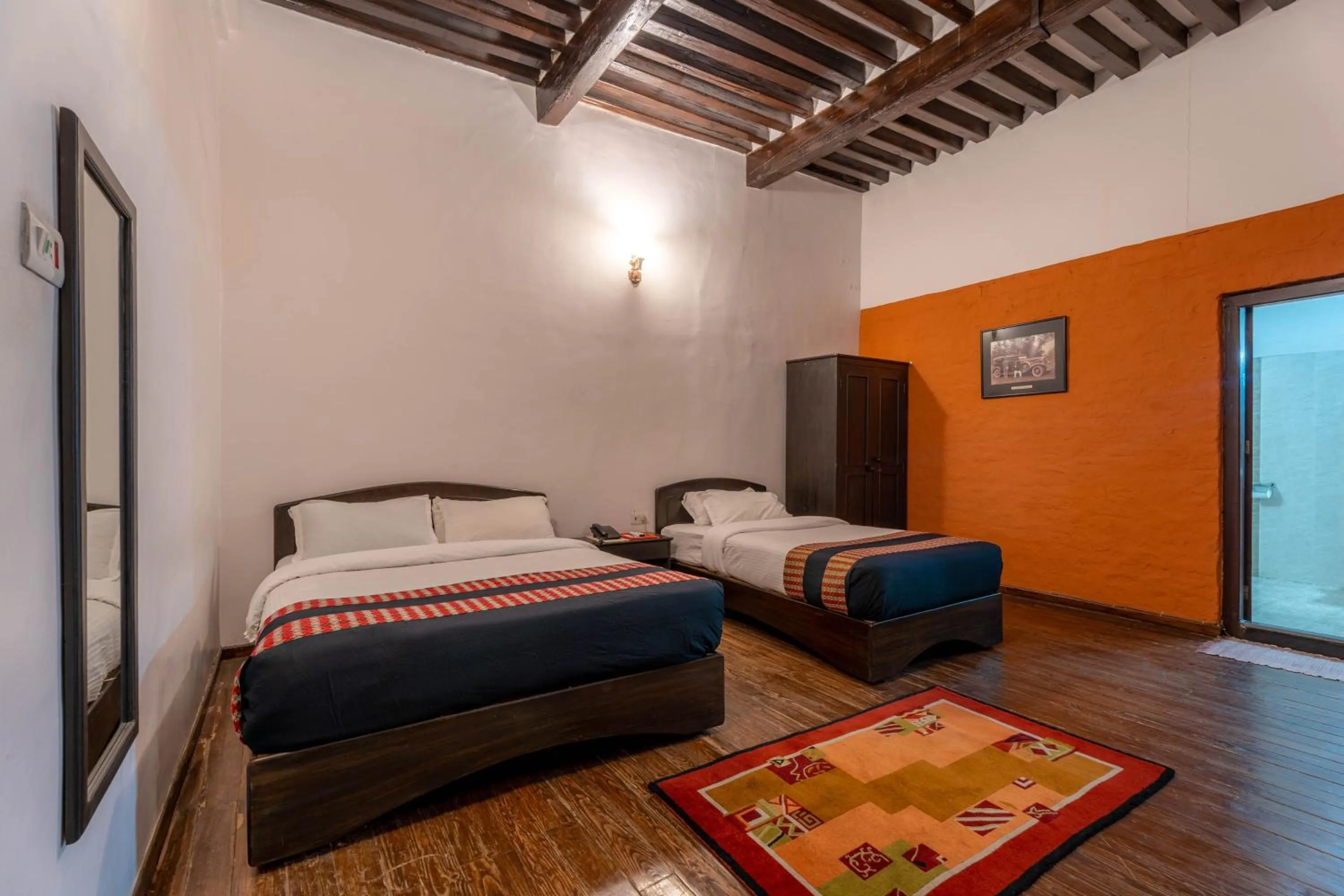 Photo of the whole room, Bed in Hukum Darbar Restaurant & Hotel