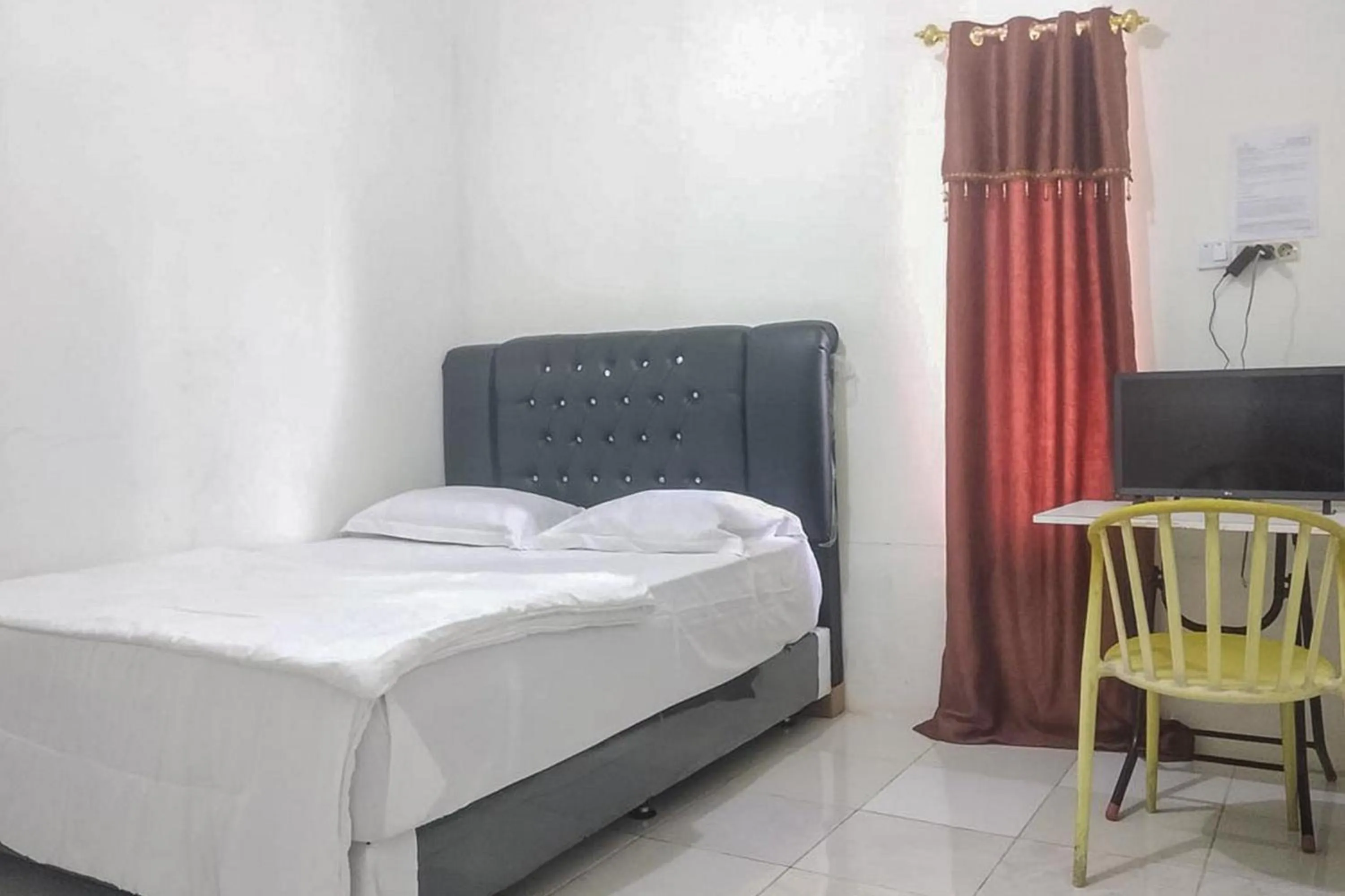 Bed in Nayla Homestay Jambi Mitra RedDoorz