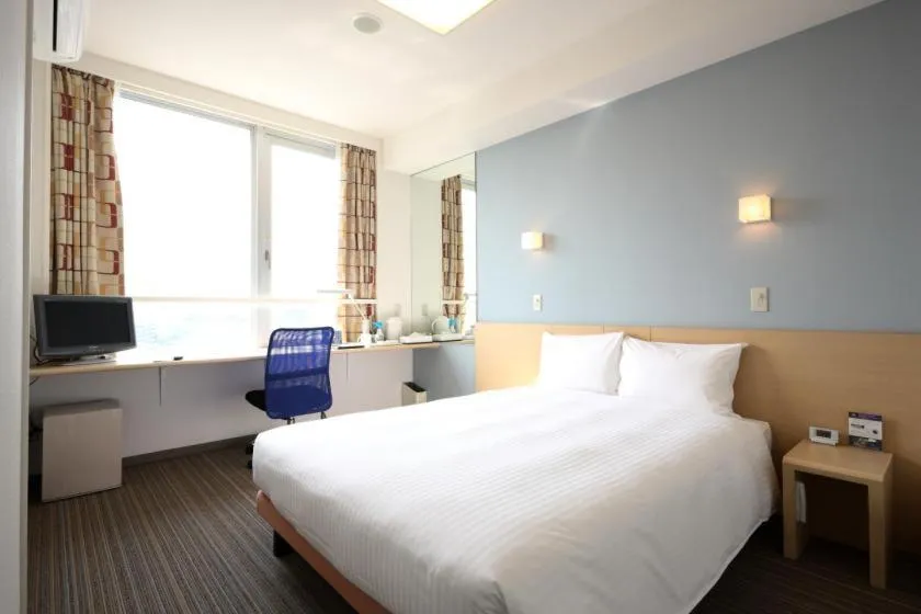 Bed in Smile Hotel Sendai Tagajyo