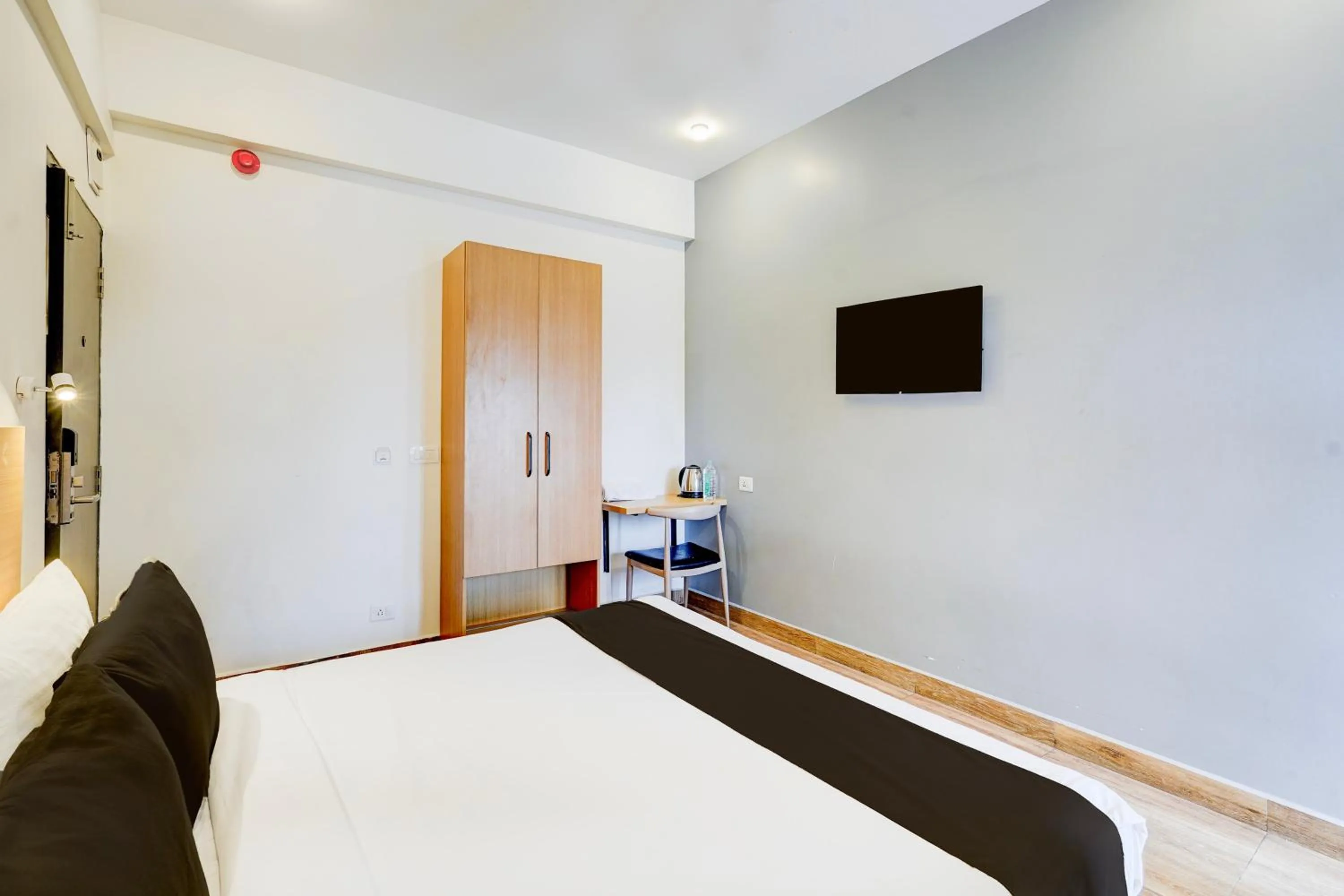 Bedroom, Bed in Super Townhouse Tirupati