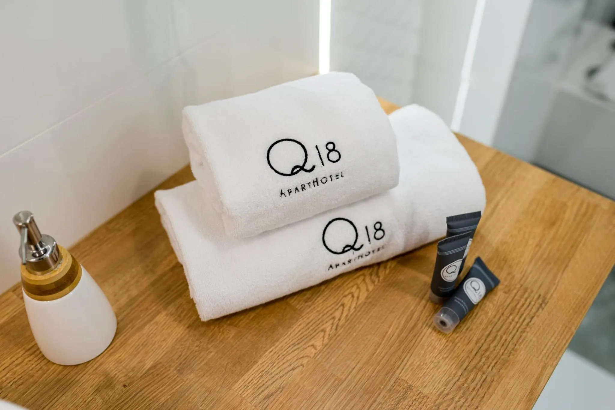 Property logo or sign in Q18 ApartHotel