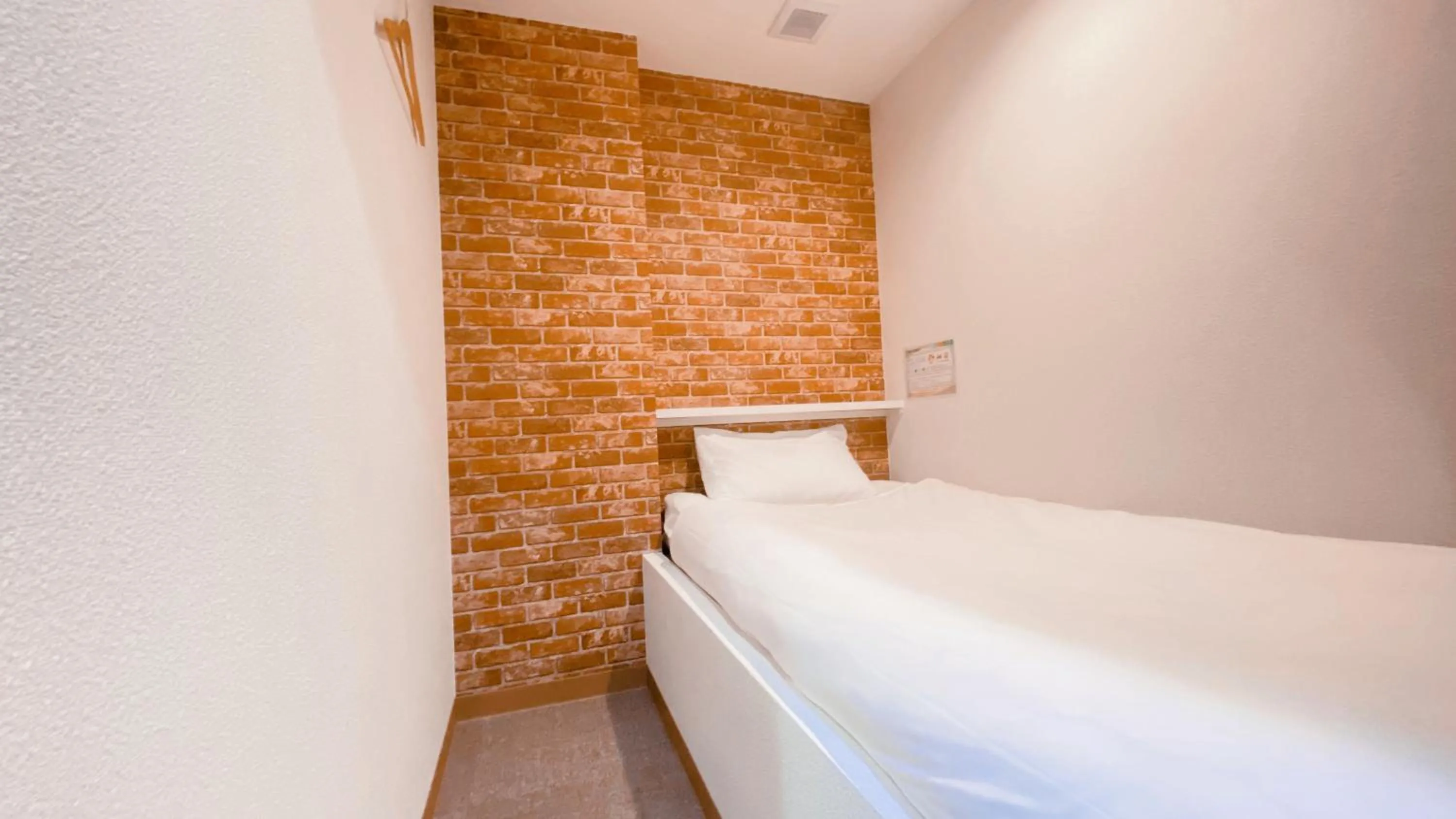 Bed in Tabist Hotel Miyakonojo Miyazaki