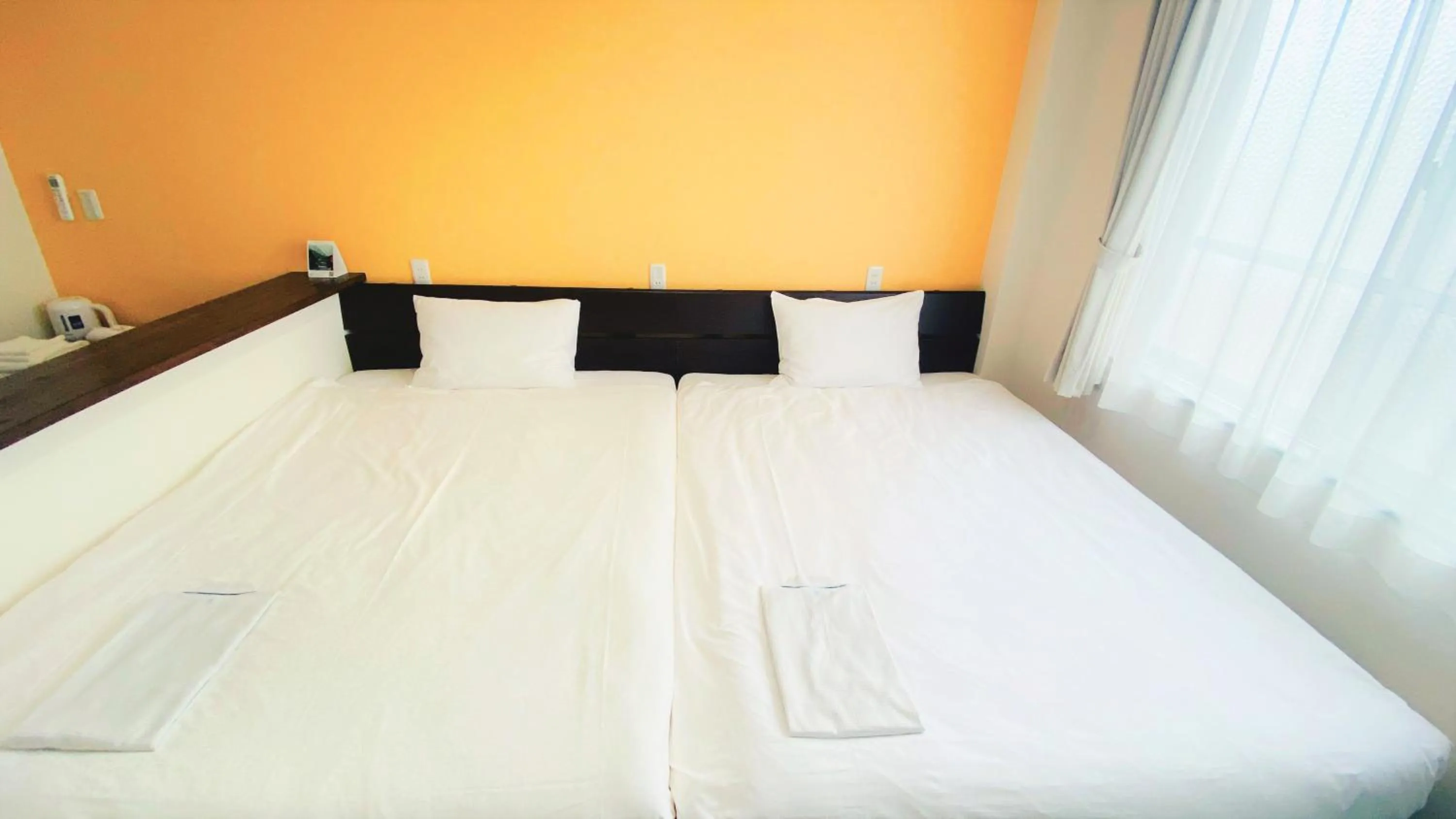 Bed in Tabist Hotel Miyakonojo Miyazaki