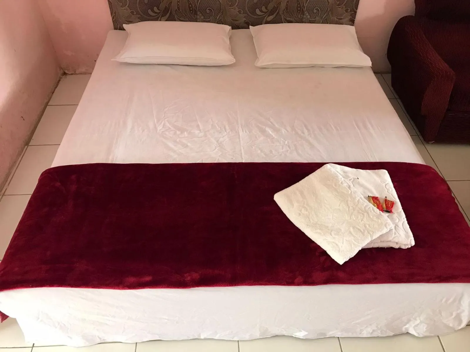 Bed in Hotel Miranda at Desa Wisata Berastagi