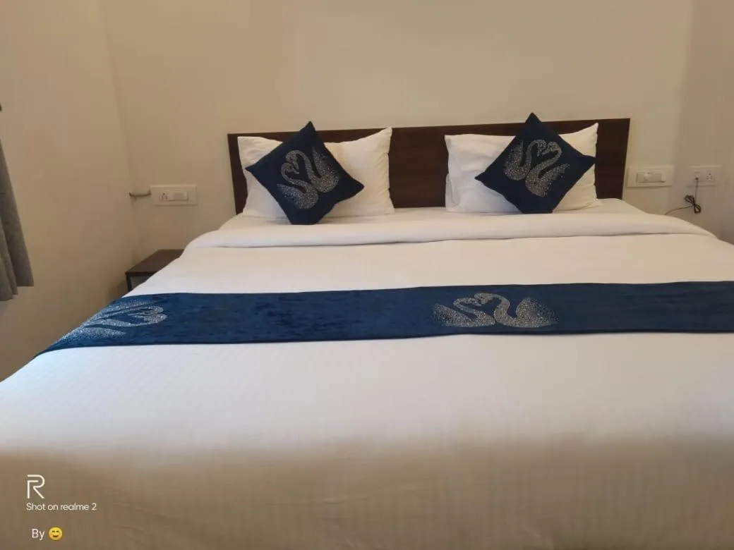 Bed in Hotel Amulya Fine Dine