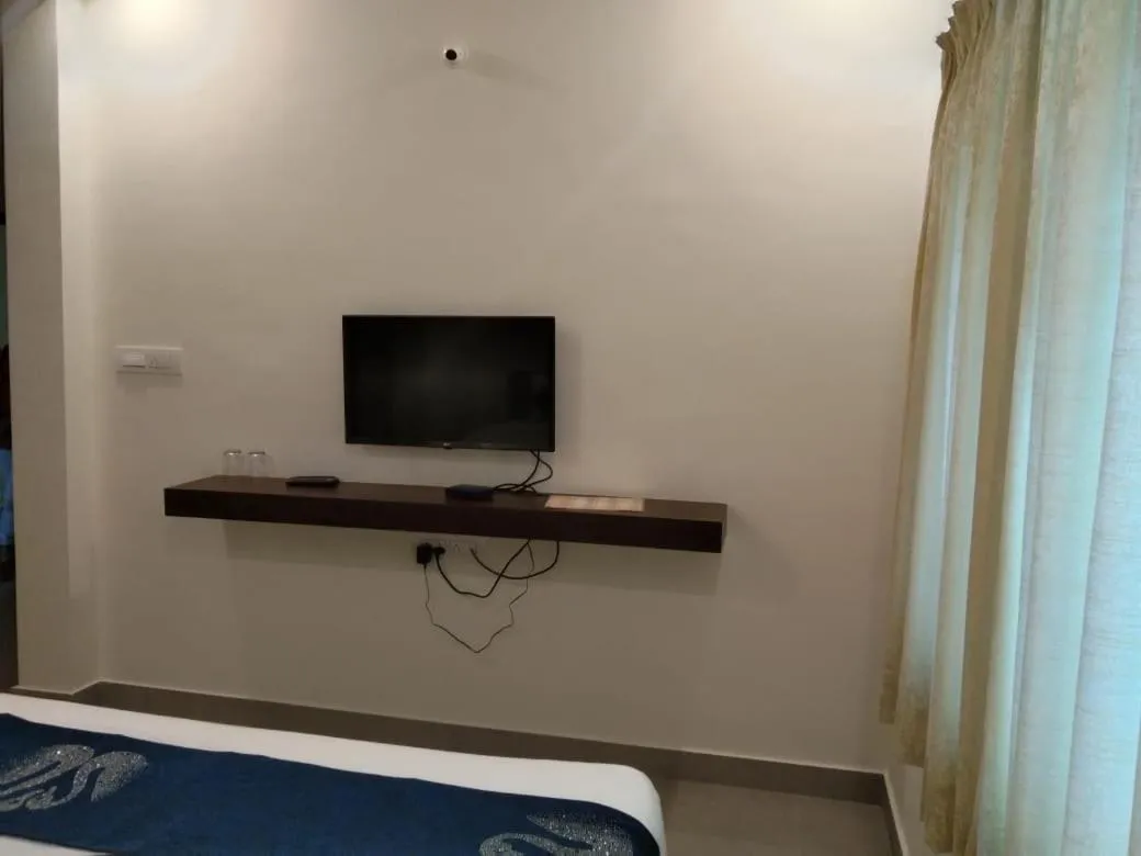 Bed in Hotel Amulya Fine Dine