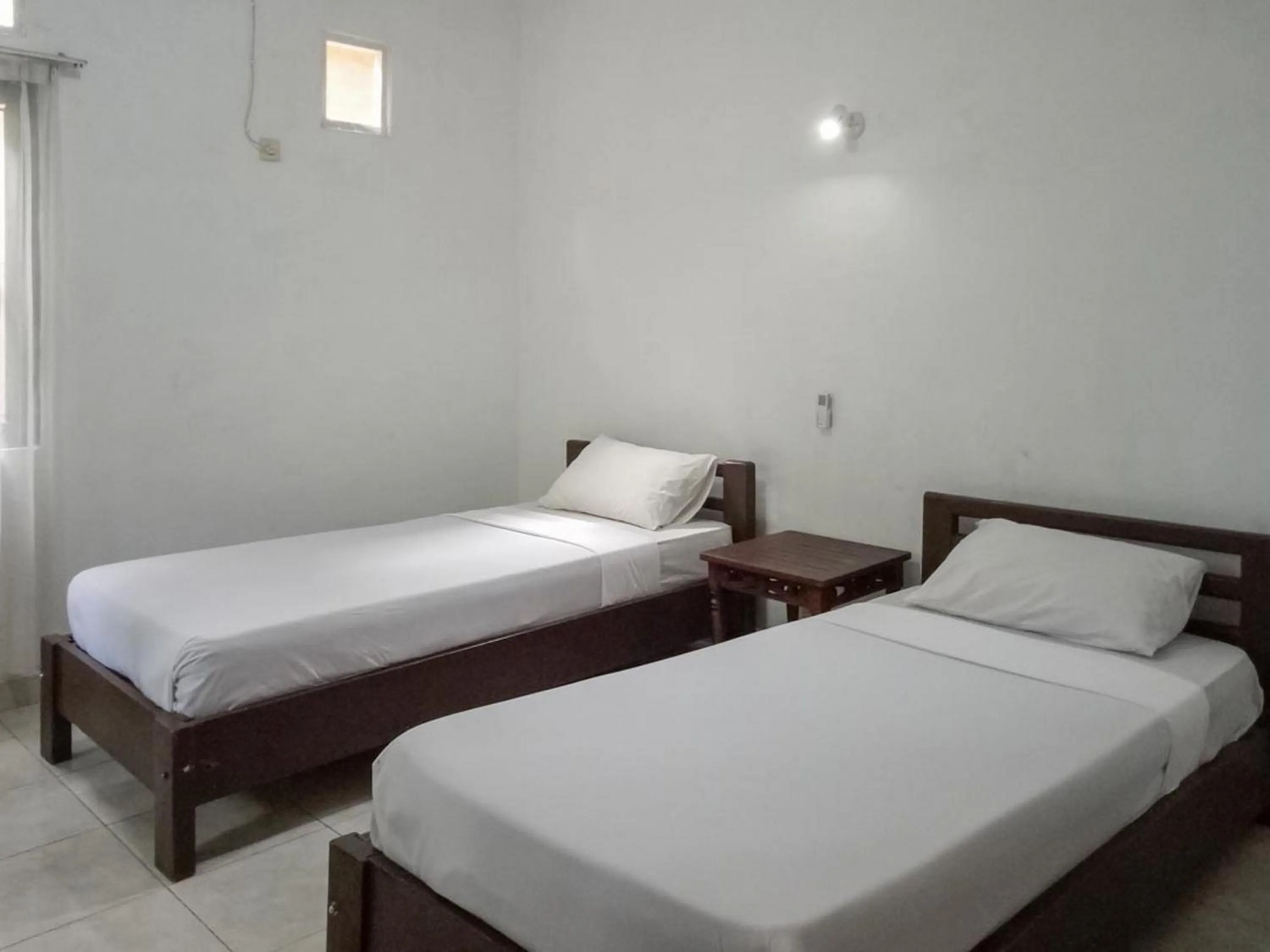 Bed in DATON HOUSE near Bali Zoo Ubud Mitra RedDoorz