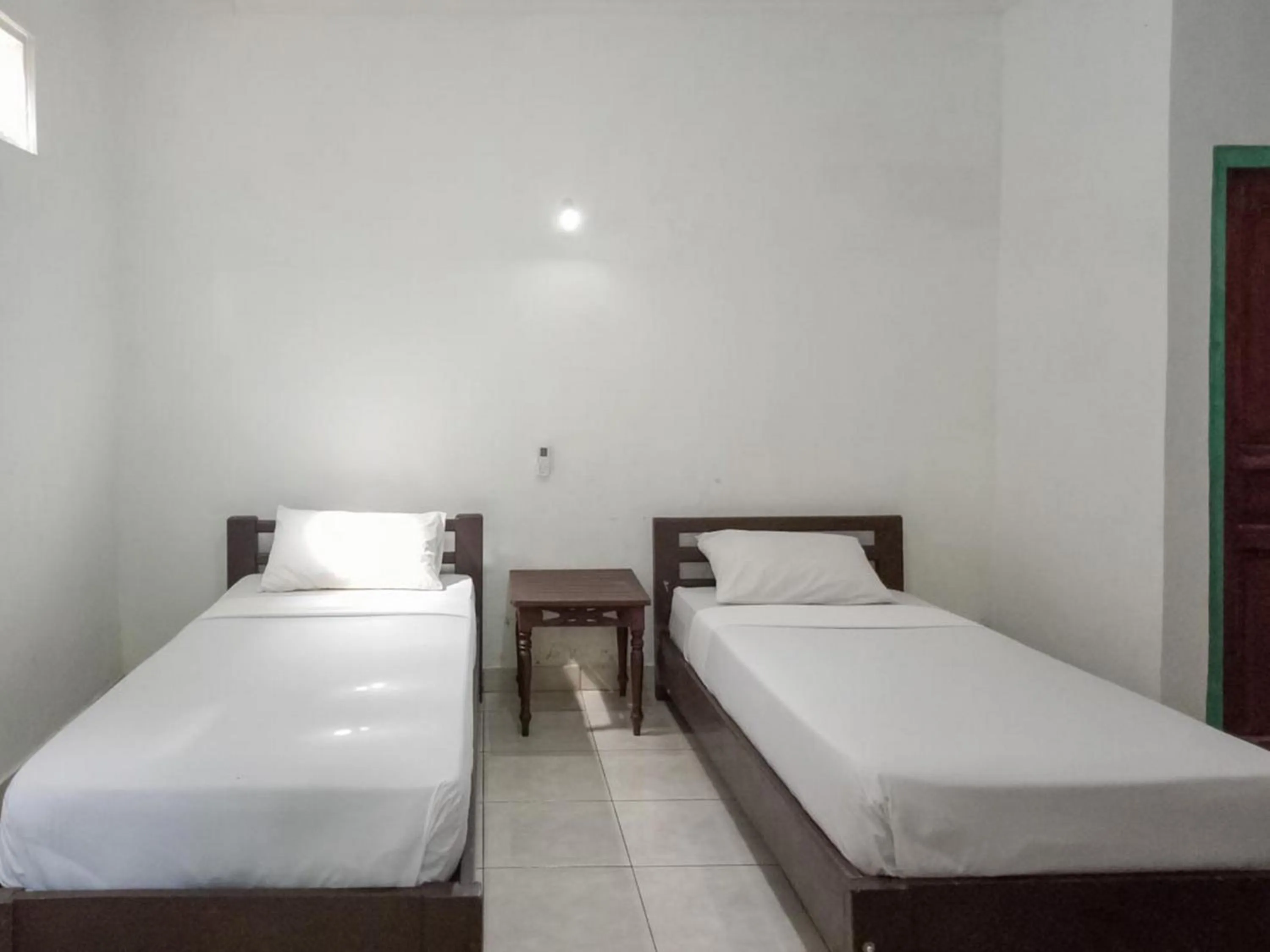 Bed in DATON HOUSE near Bali Zoo Ubud Mitra RedDoorz