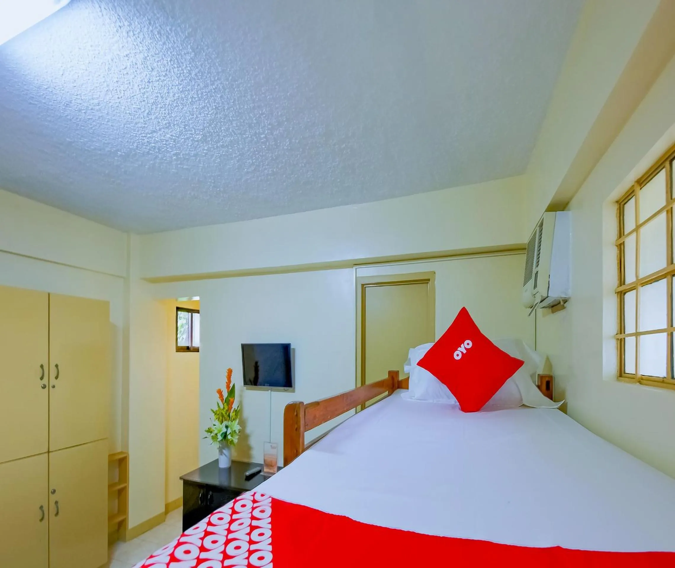 Bedroom in OYO 840 Orangenest Apartelle