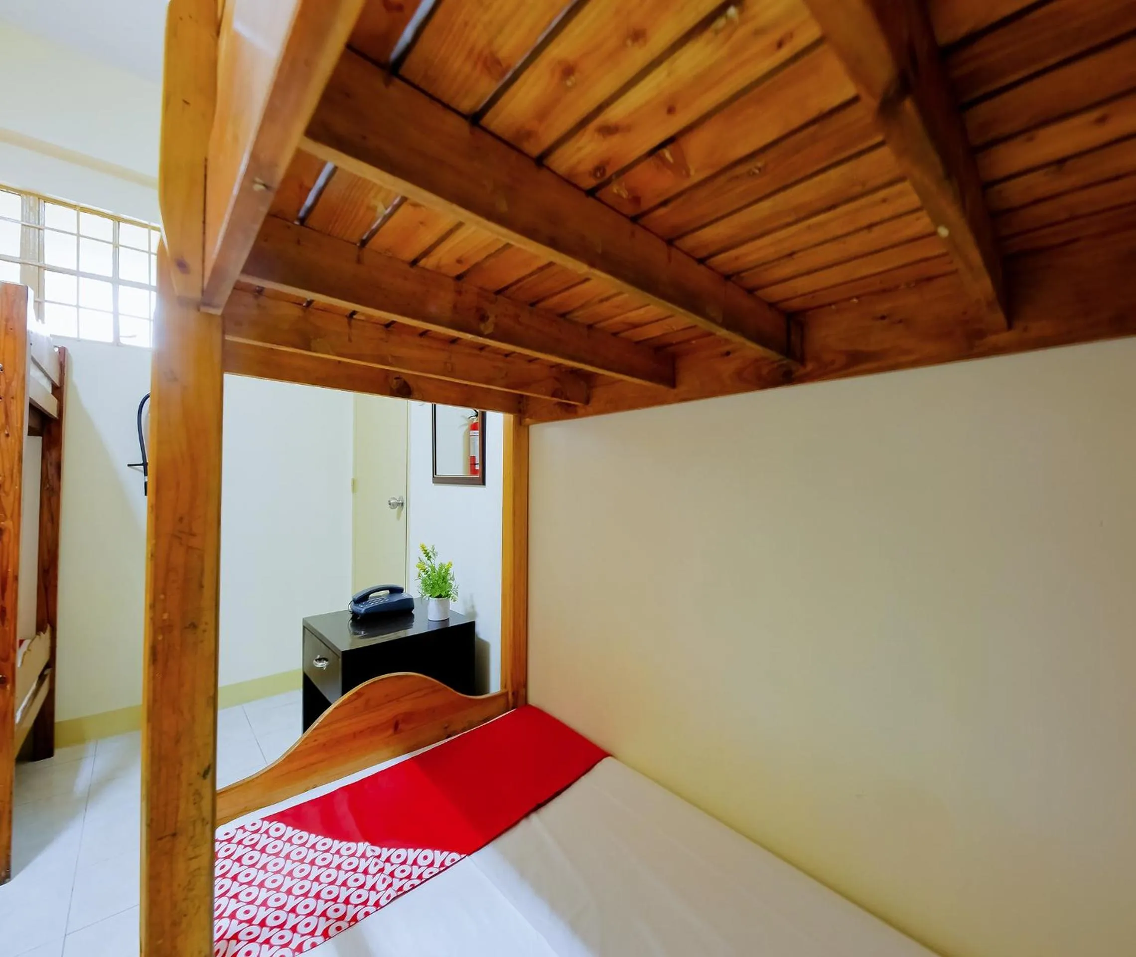 Bedroom in OYO 840 Orangenest Apartelle