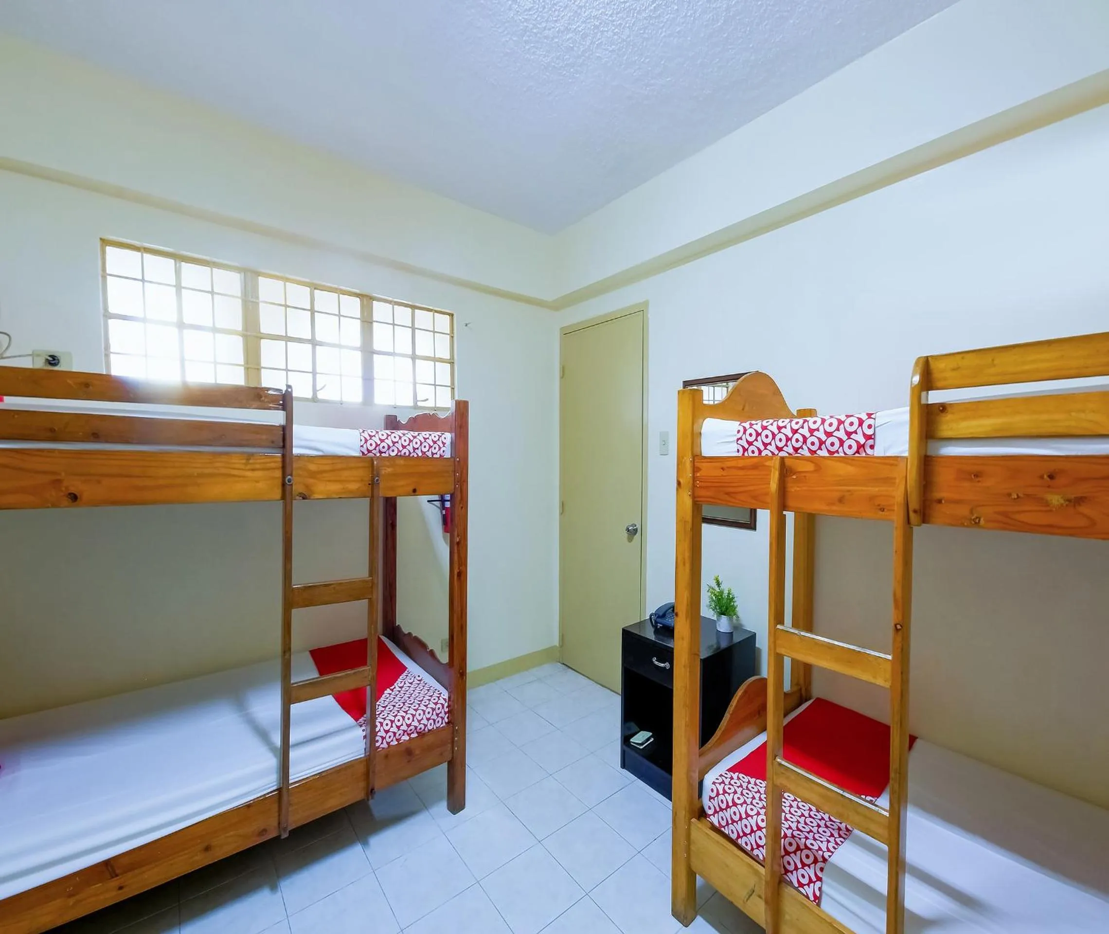 Bedroom in OYO 840 Orangenest Apartelle