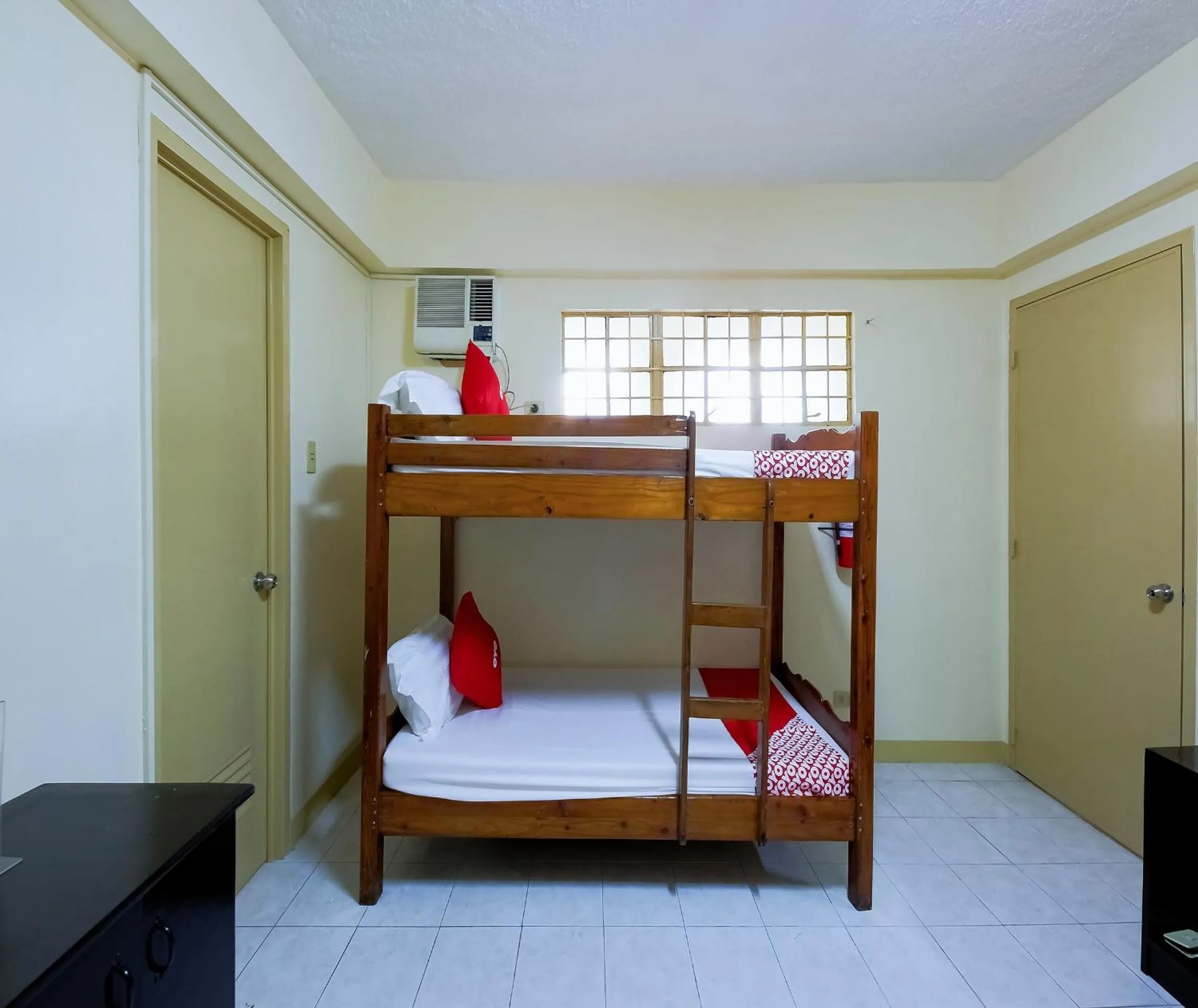 Bedroom in OYO 840 Orangenest Apartelle