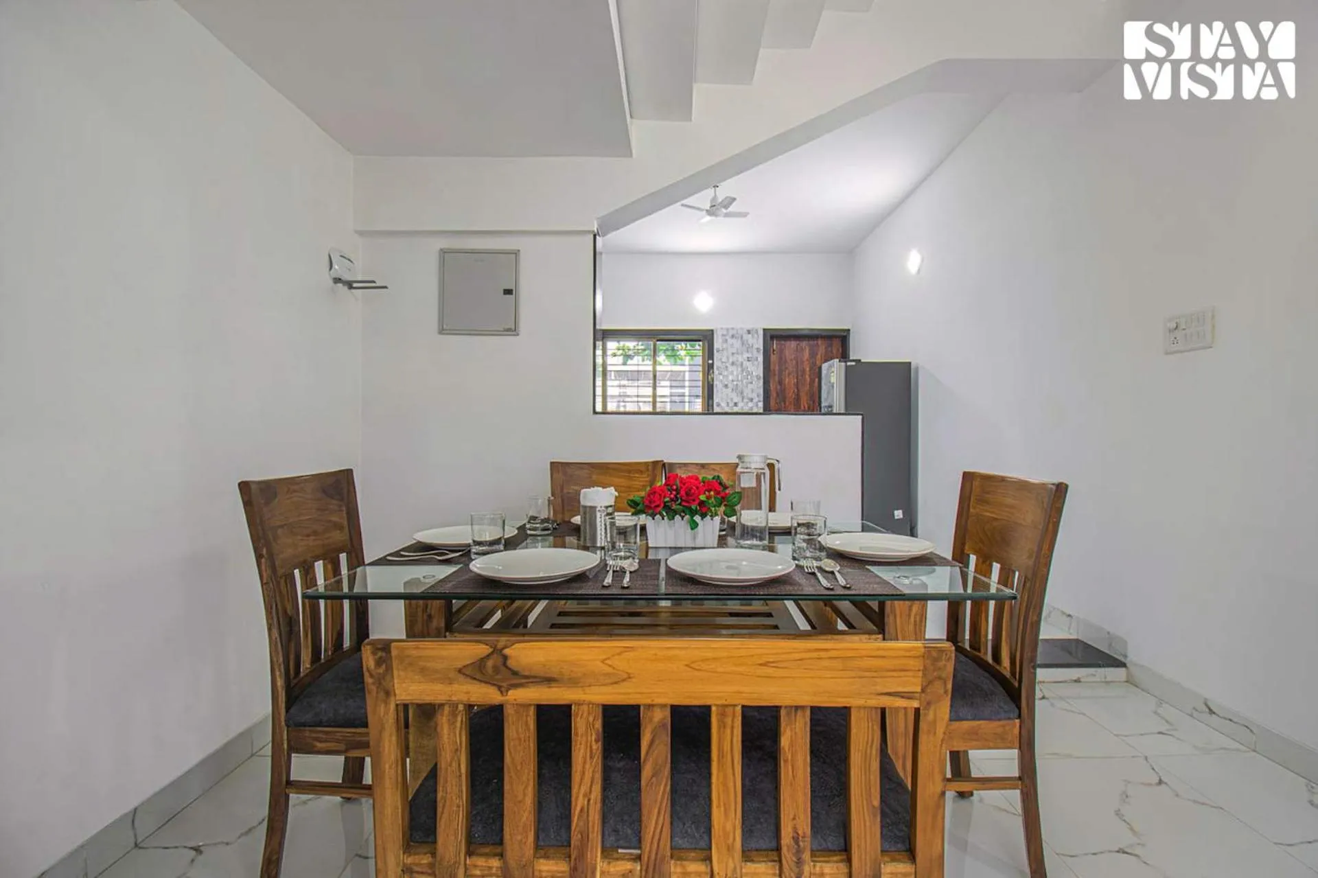 Dining area in StayVista's Brookvale Cottage - Dive into tranquility with pool view and gazebo