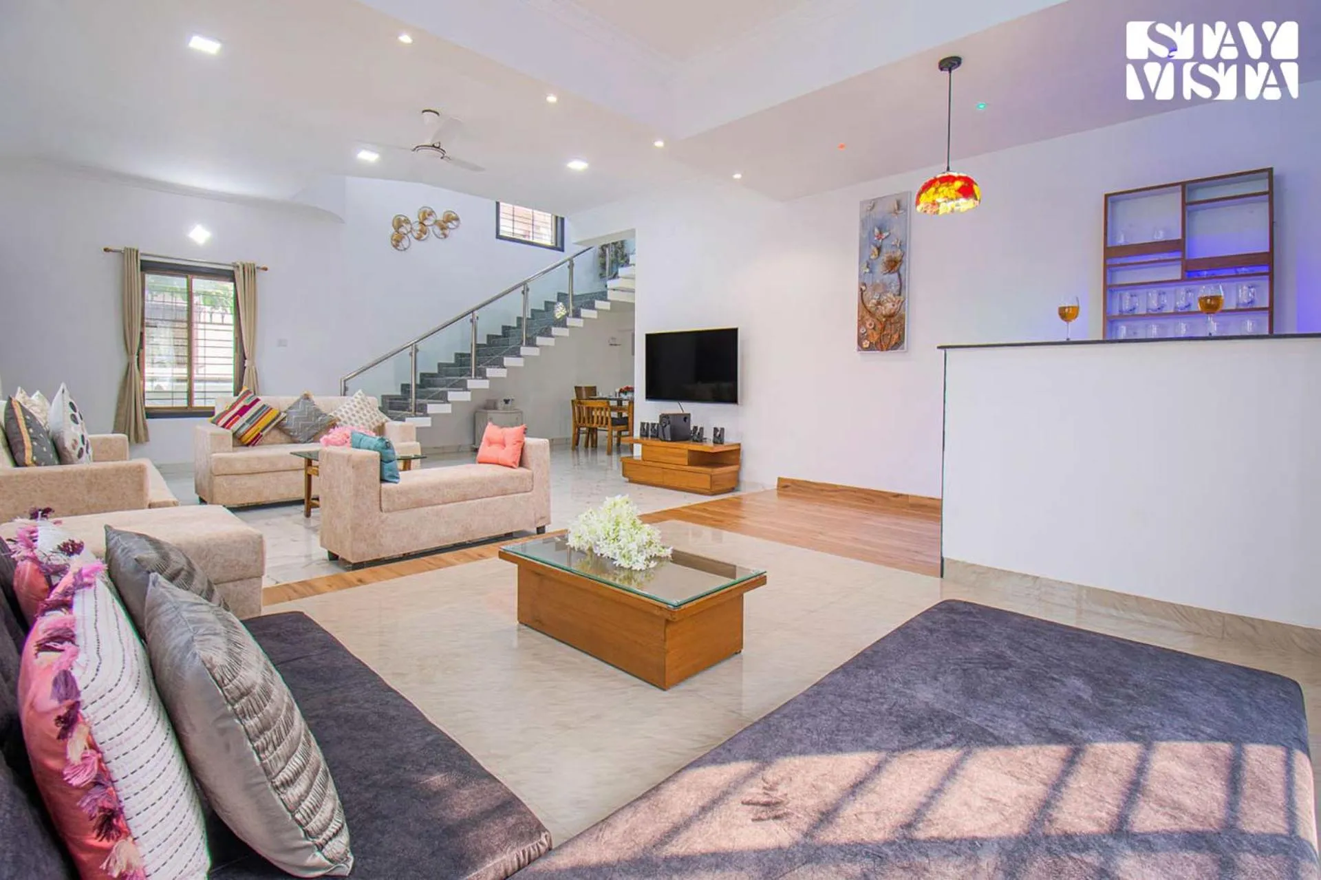 Living room in StayVista's Brookvale Cottage - Dive into tranquility with pool view and gazebo