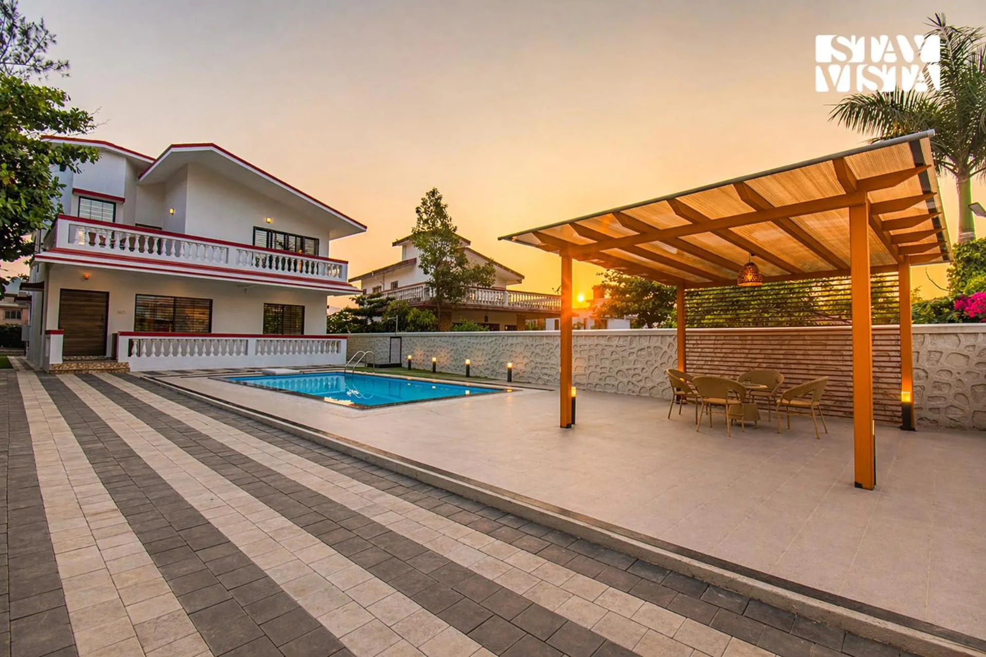 Property building in StayVista's Brookvale Cottage - Dive into tranquility with pool view and gazebo