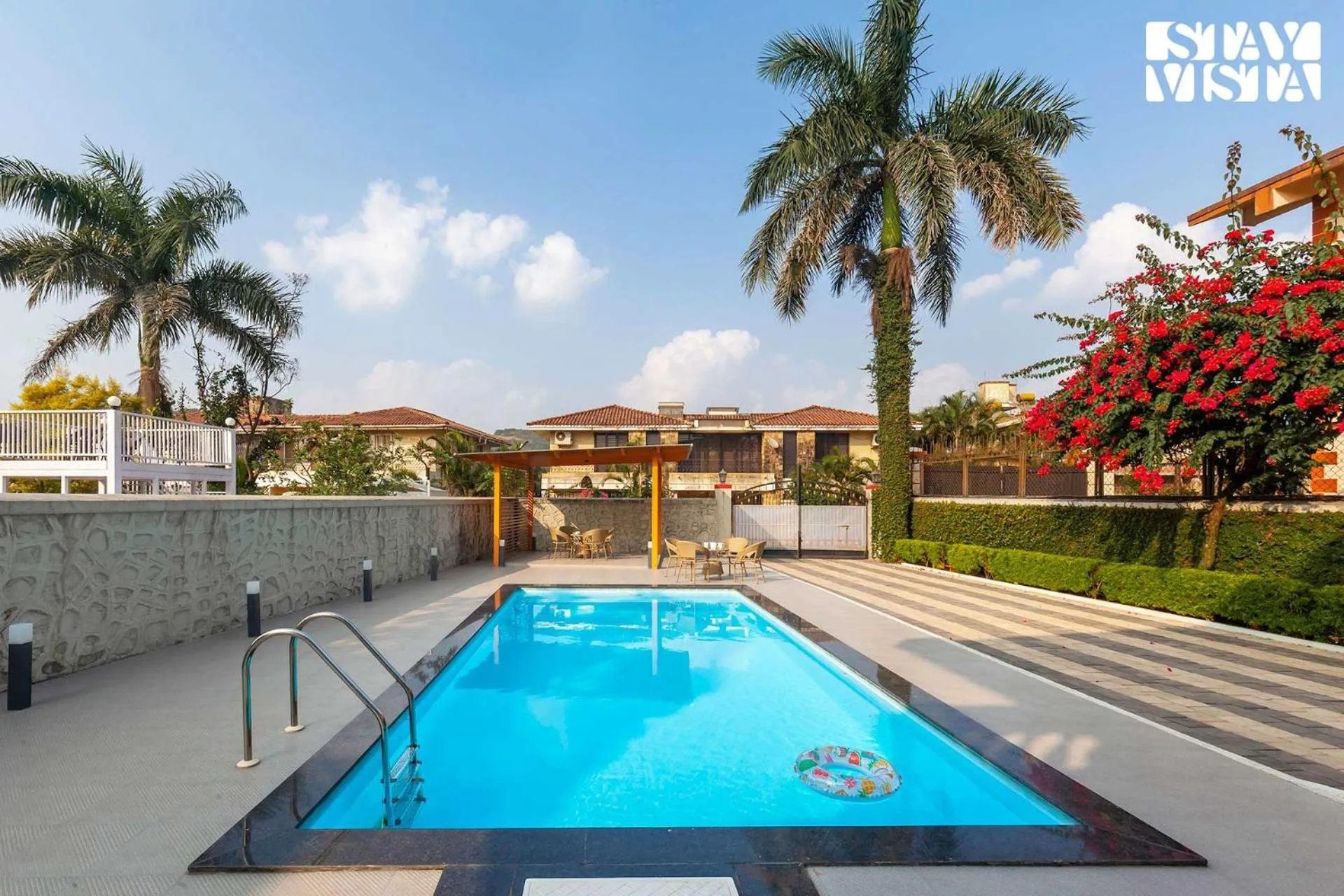 Swimming pool in StayVista's Brookvale Cottage - Dive into tranquility with pool view and gazebo