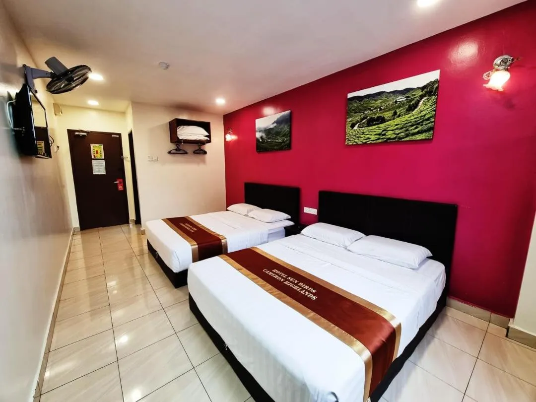 Bed in Hotel Sun Birds