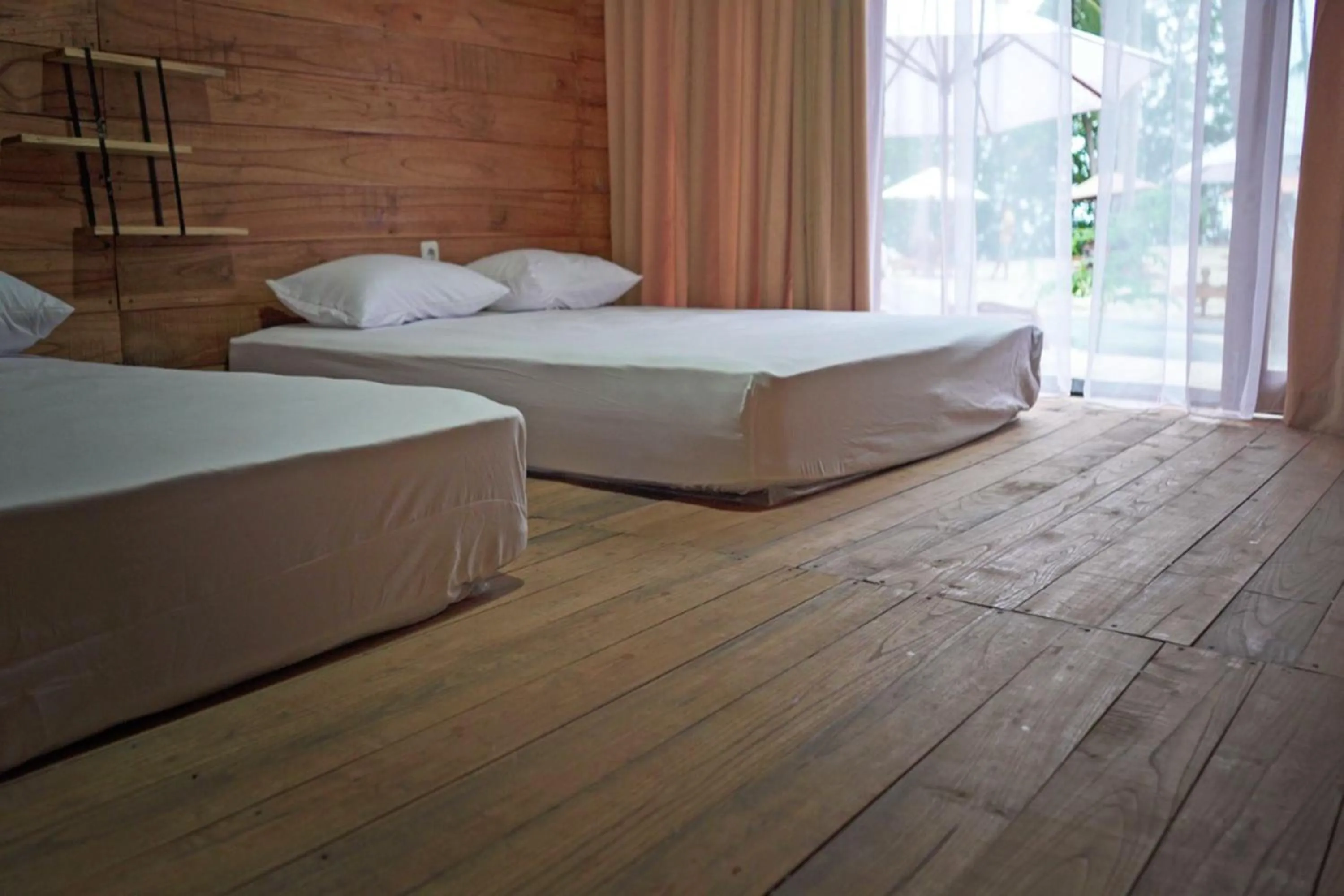 Bedroom in Pulau Mahitam Resort & Cottage by Hotelku