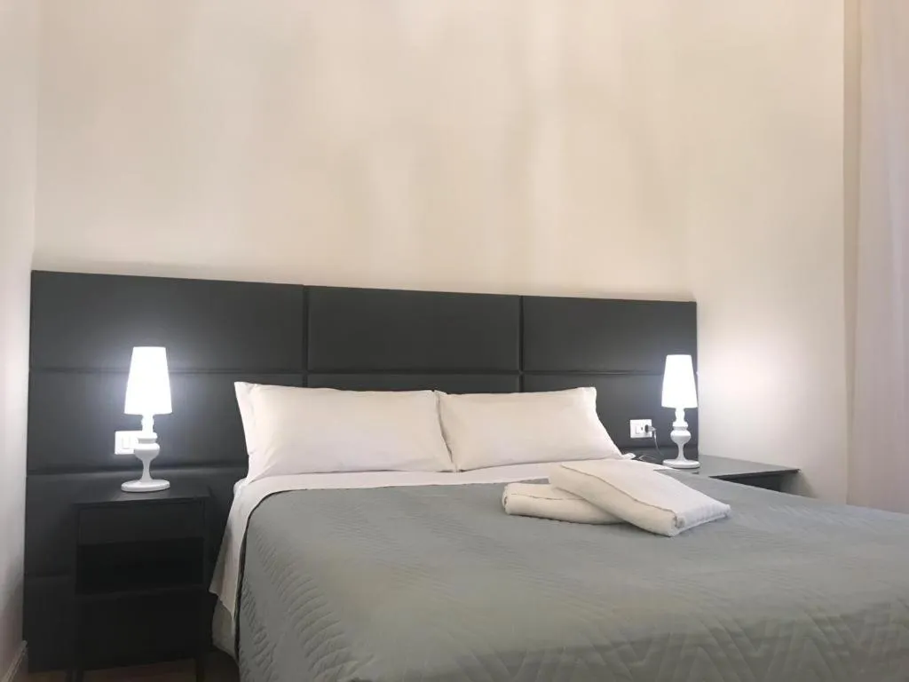 Bed in Motta Palace Apartments & Rooms