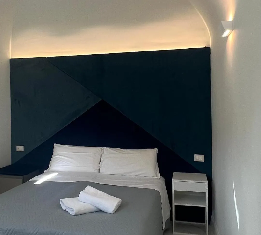 Bed in Motta Palace Apartments & Rooms