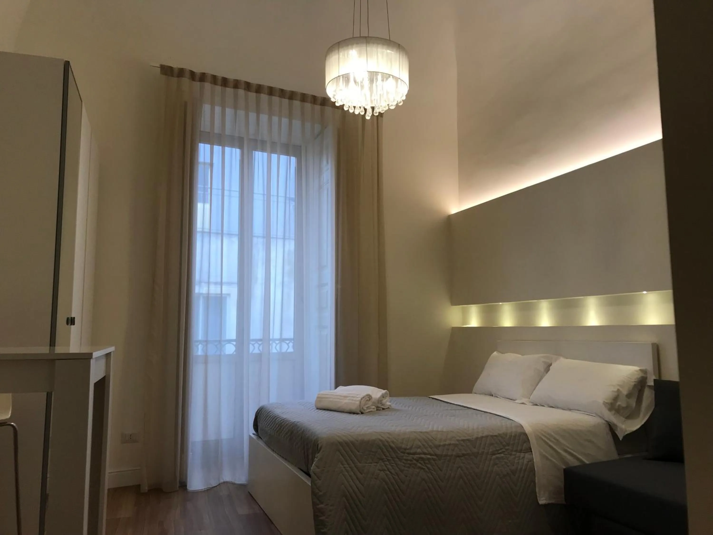 Bed in Motta Palace Apartments & Rooms