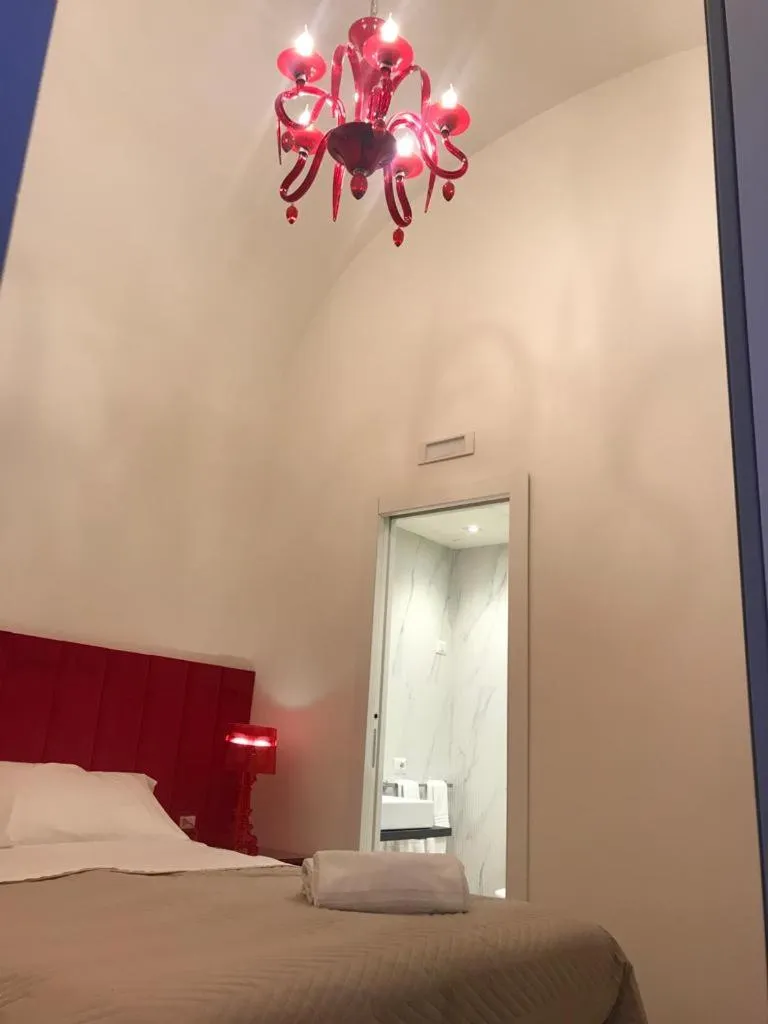 Bed in Motta Palace Apartments & Rooms