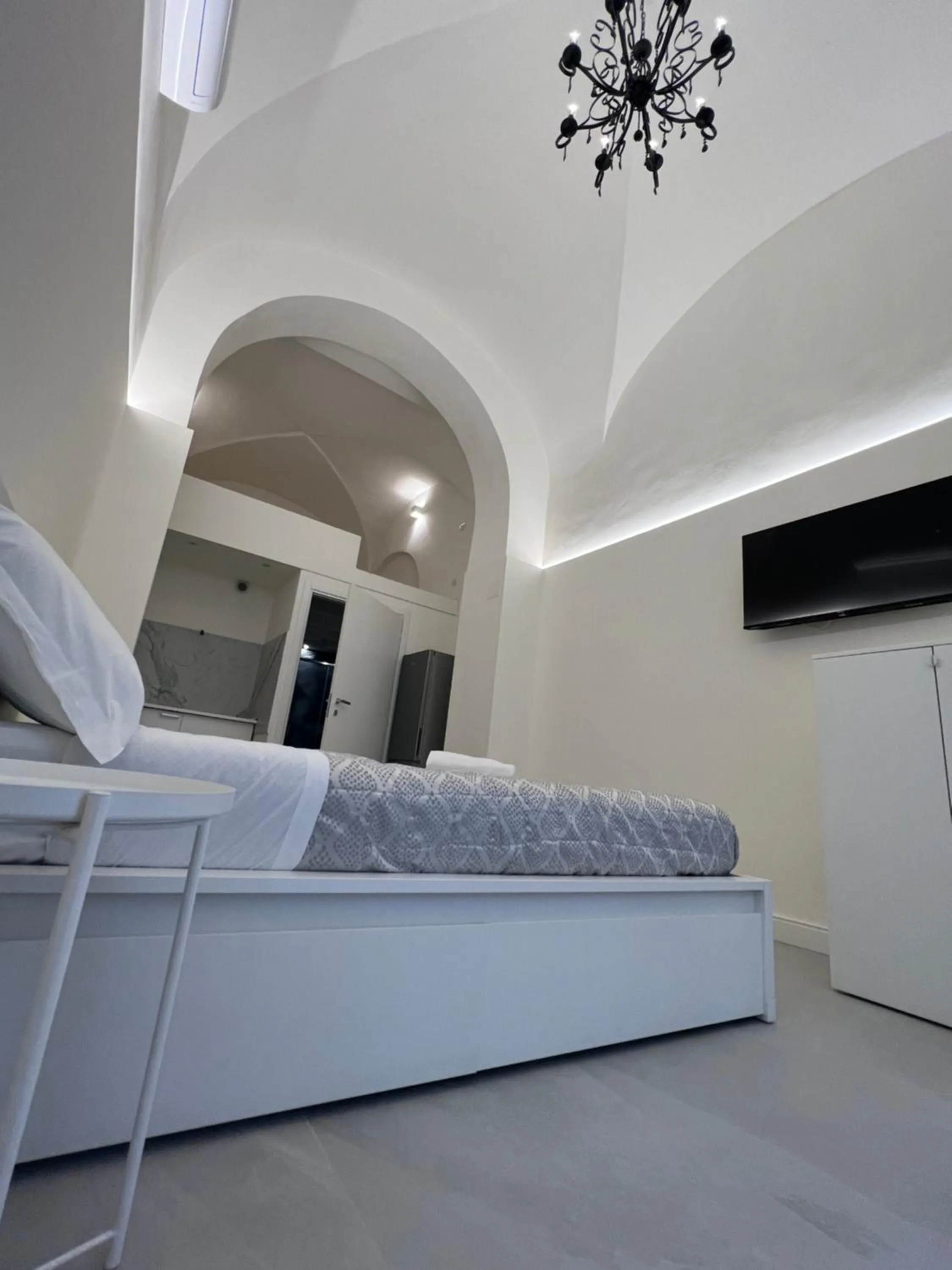 Bed in Motta Palace Apartments & Rooms