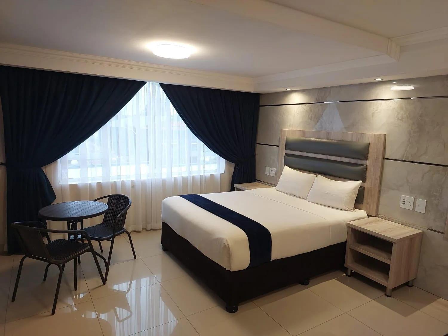 Bed in Bayside Taj Hotel