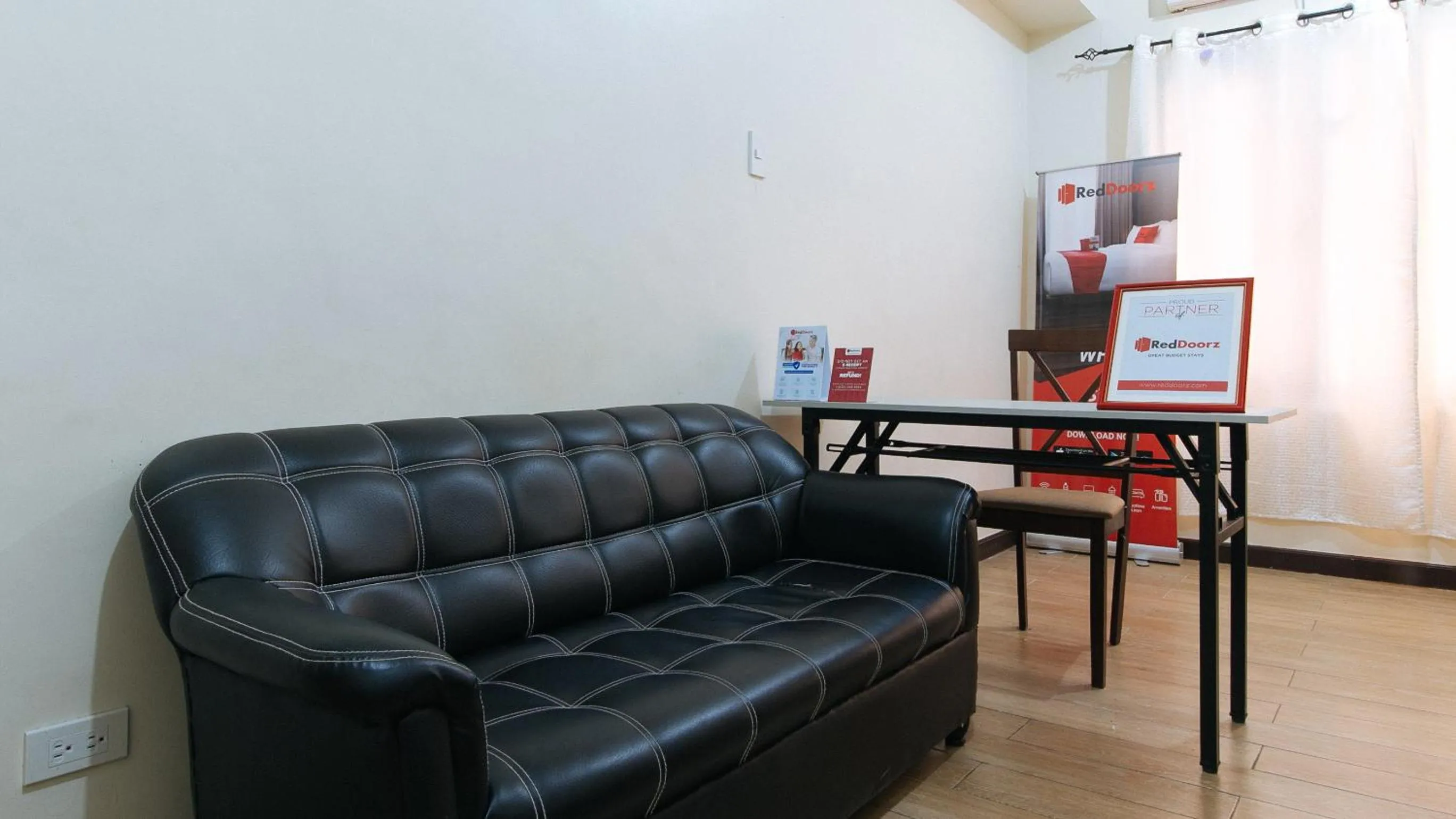 Seating area in RedDoorz Hostel at Deomar Hometel & Farm Cafe Vigan Ilocos