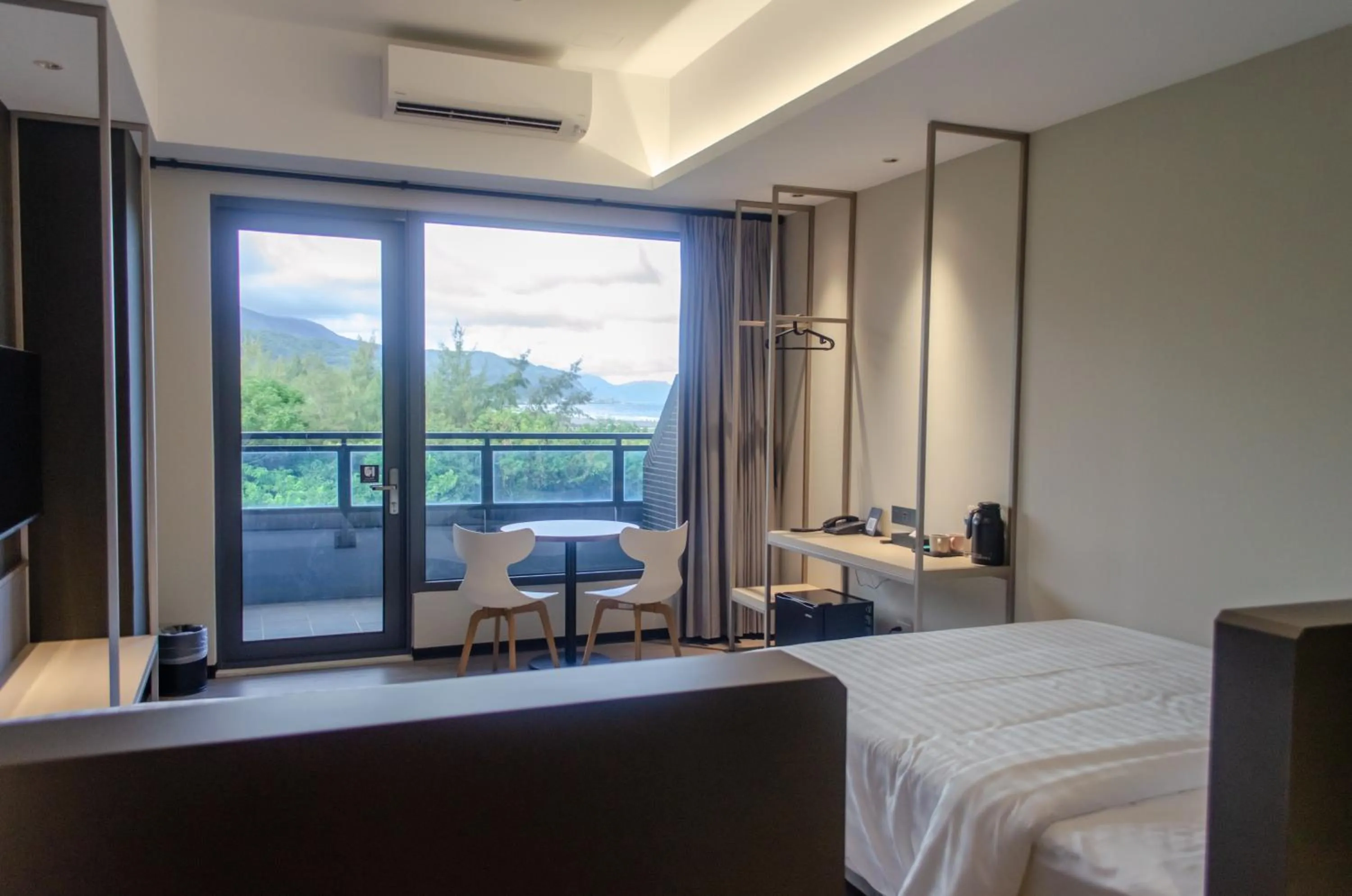 Photo of the whole room, Bed in OA HOTEL Wushih Marina