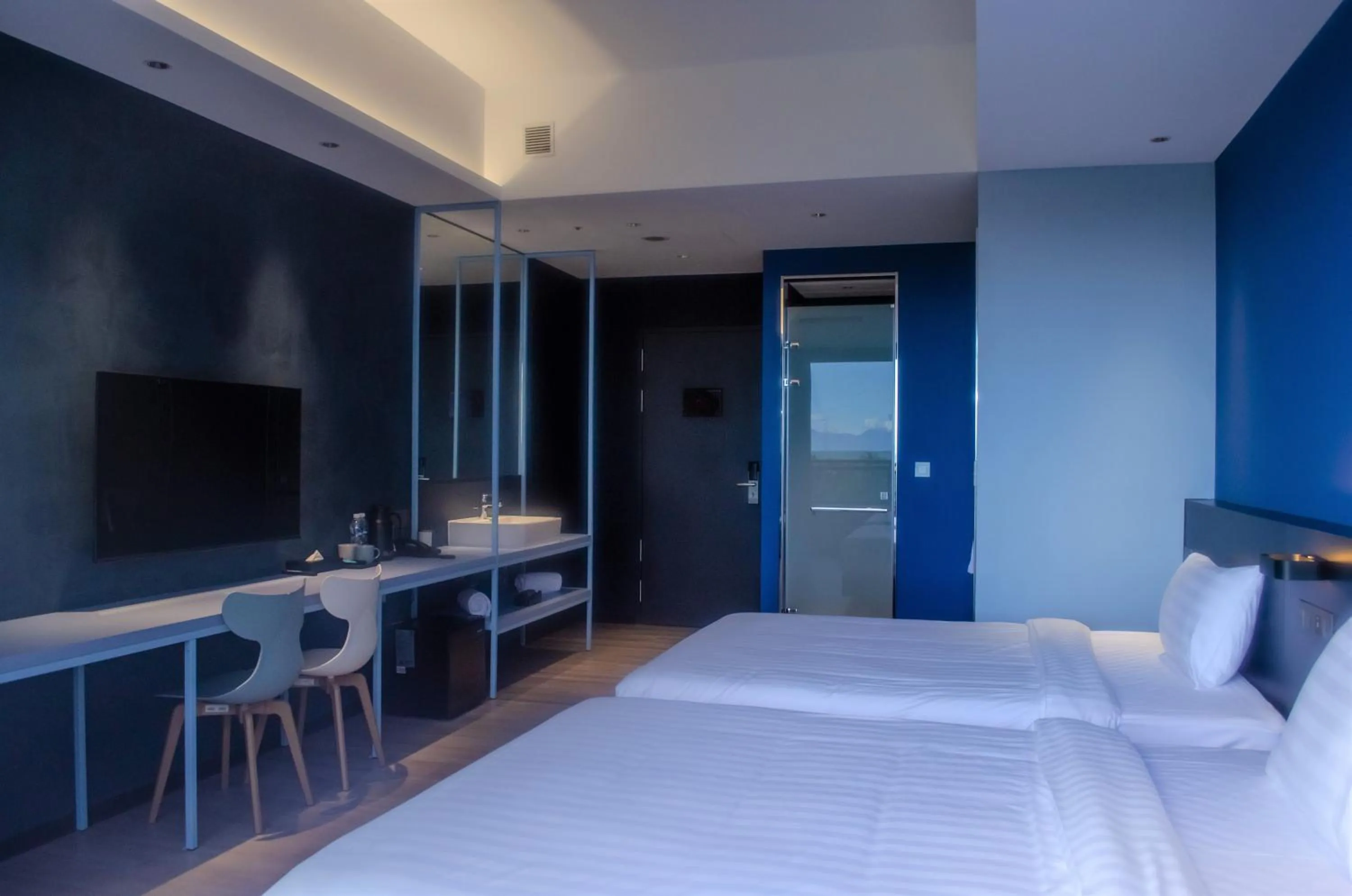 Photo of the whole room, Bed in OA HOTEL Wushih Marina
