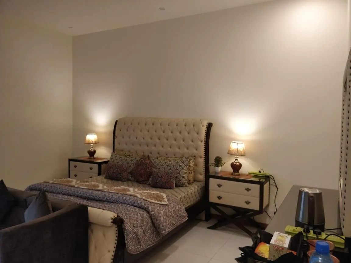 Bed in Comfyinn Guest House