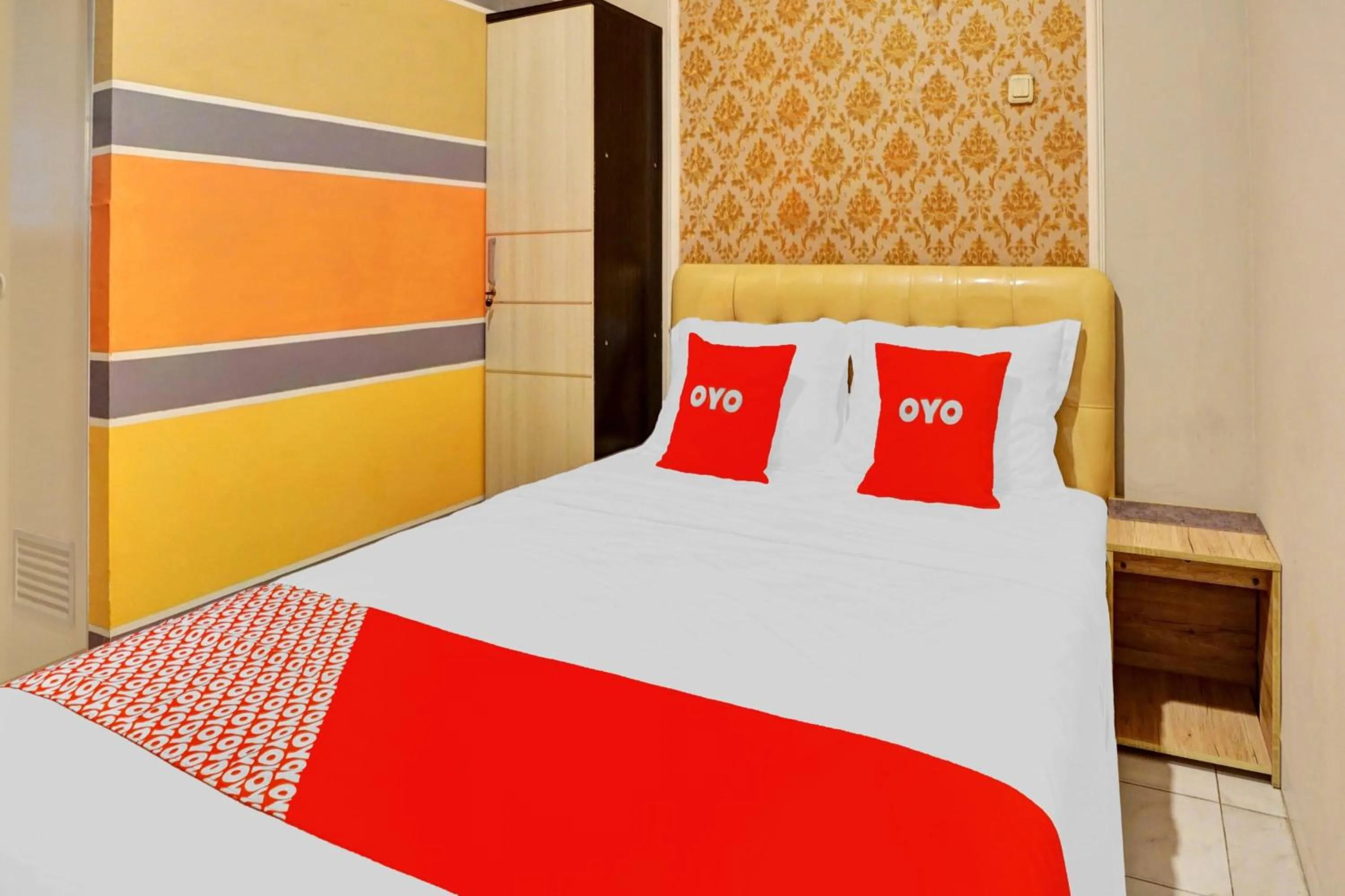 Bedroom in Hotel O Btc Guest House Syariah
