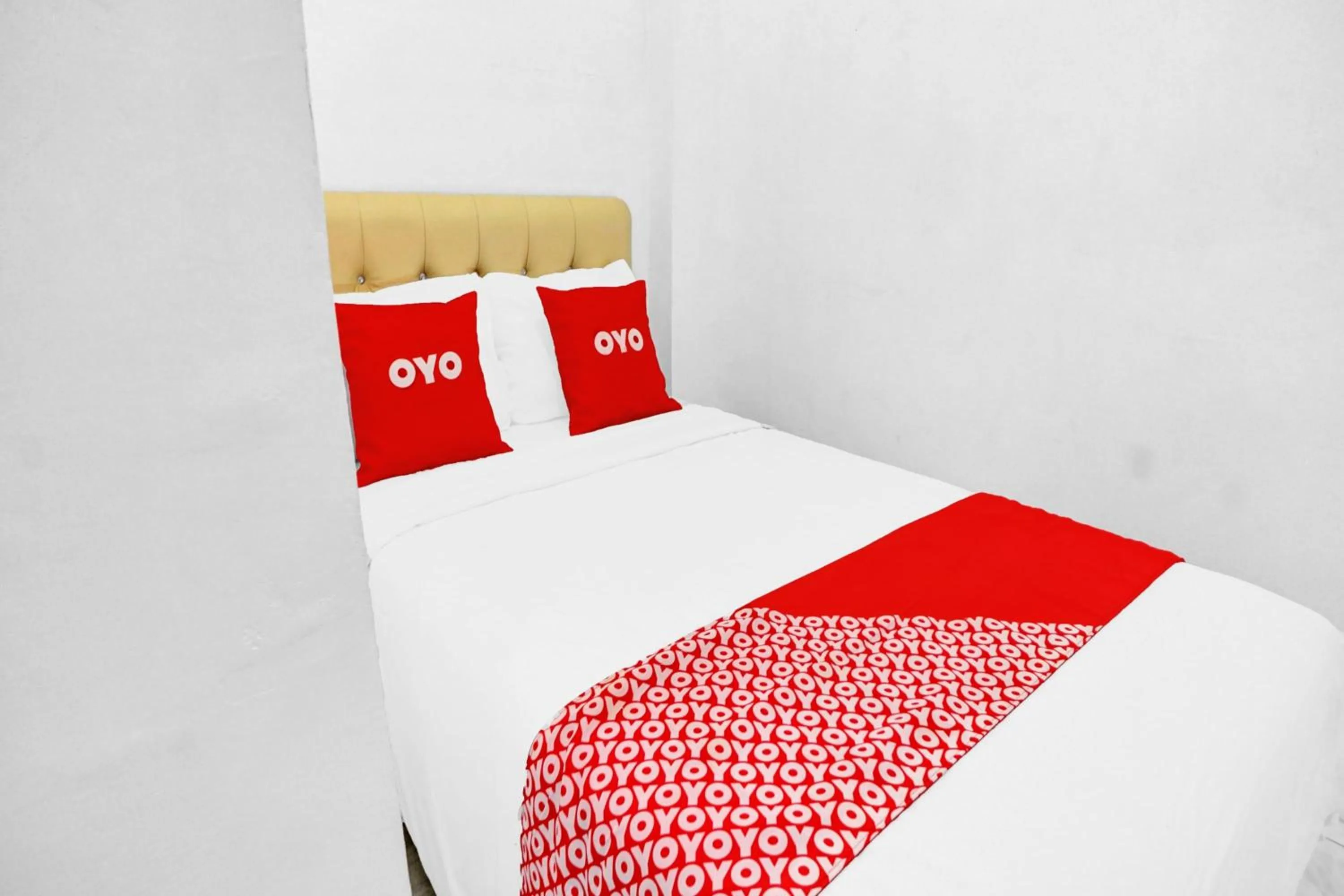 Bedroom in Hotel O Btc Guest House Syariah