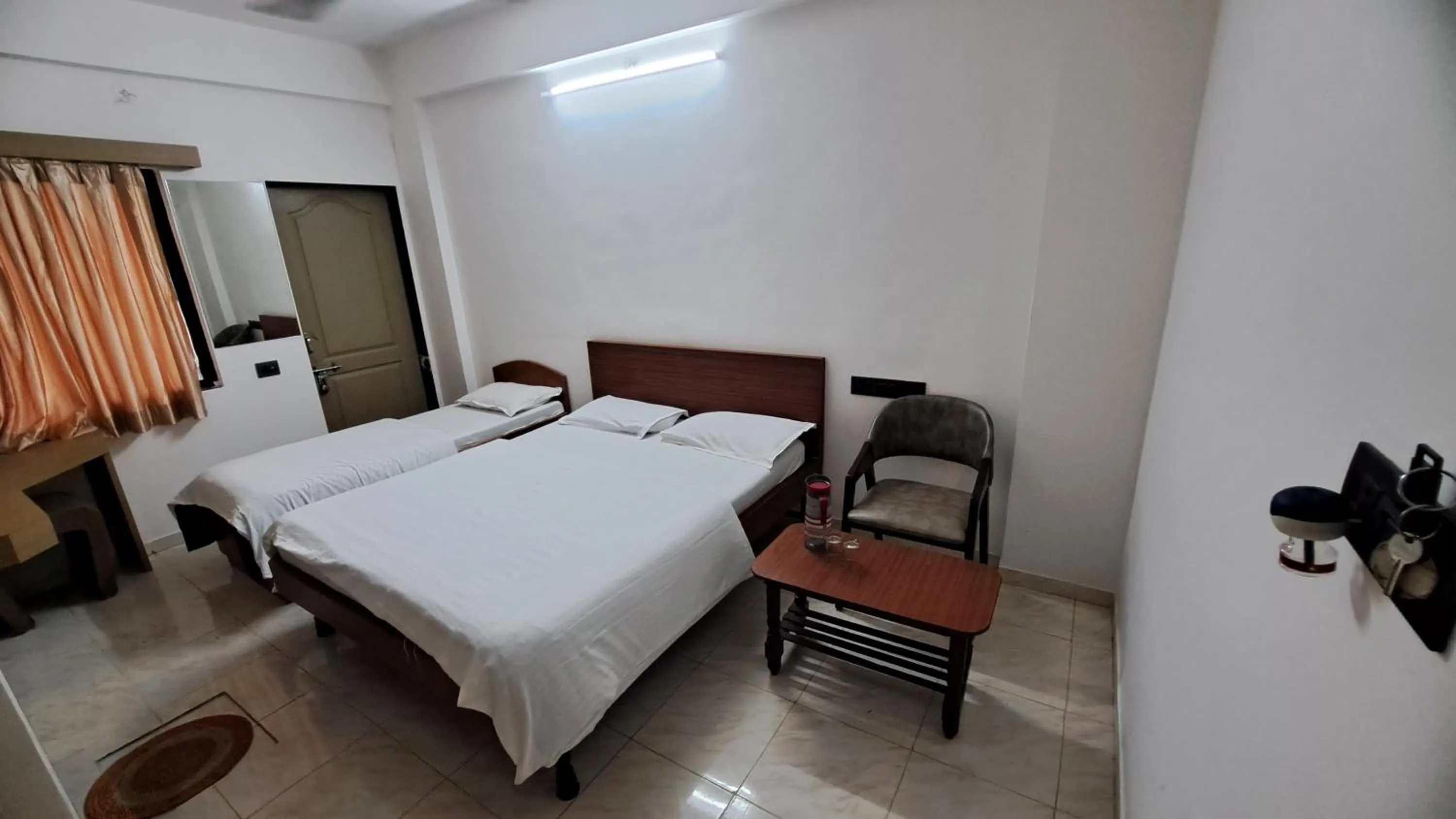 Bed in Hotel Dhruv Palace