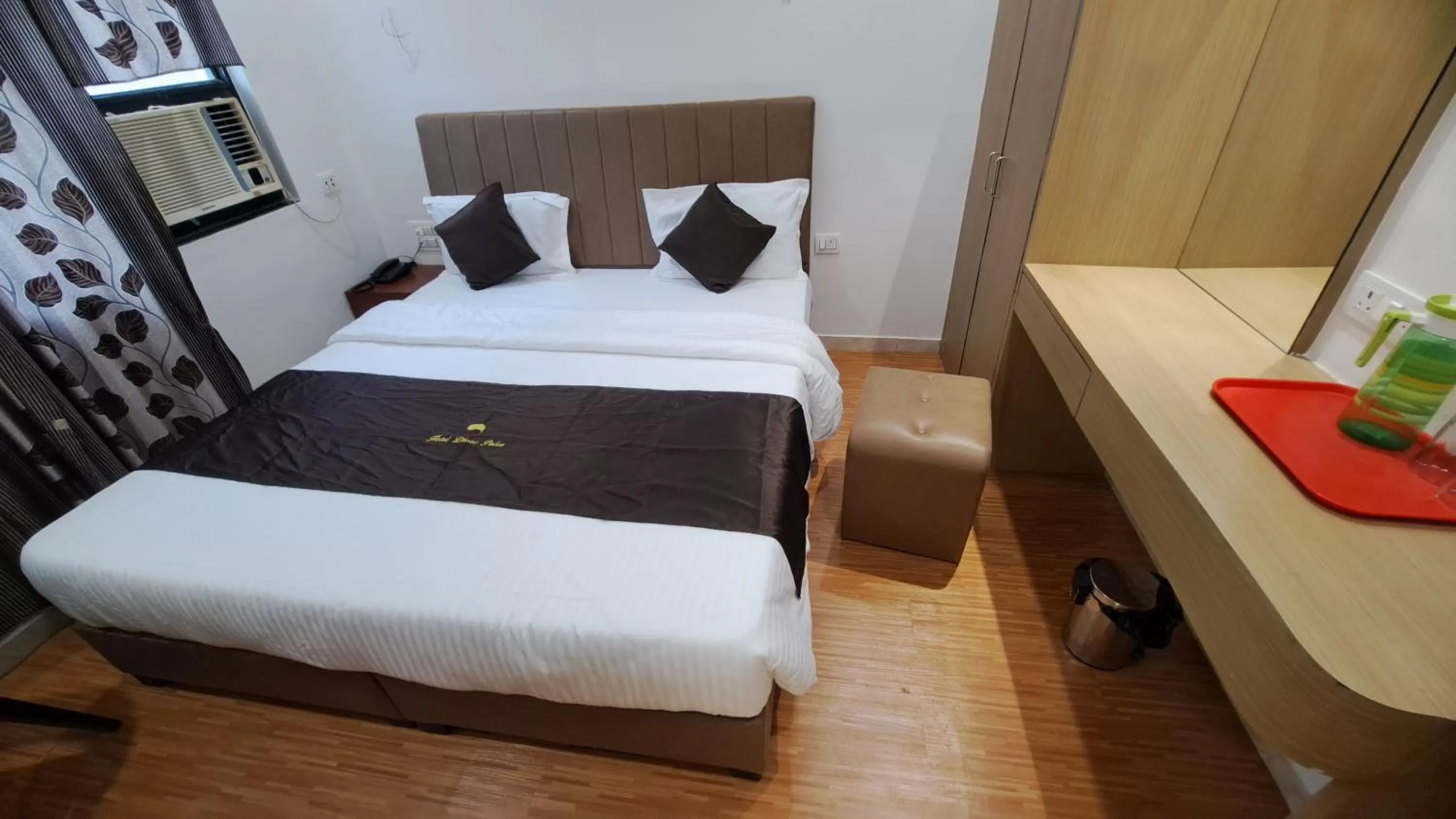 Bed in Hotel Dhruv Palace