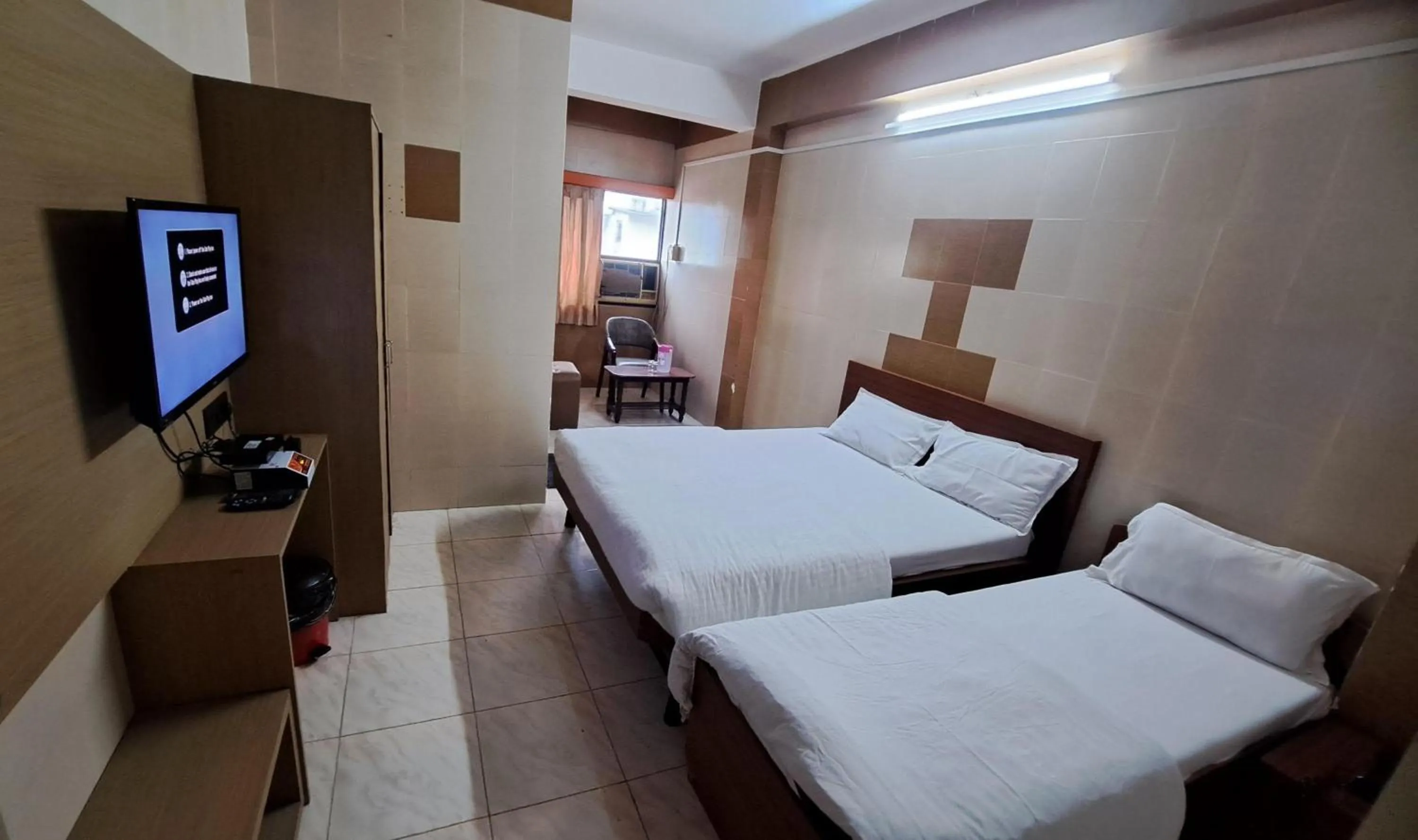 Bed in Hotel Dhruv Palace