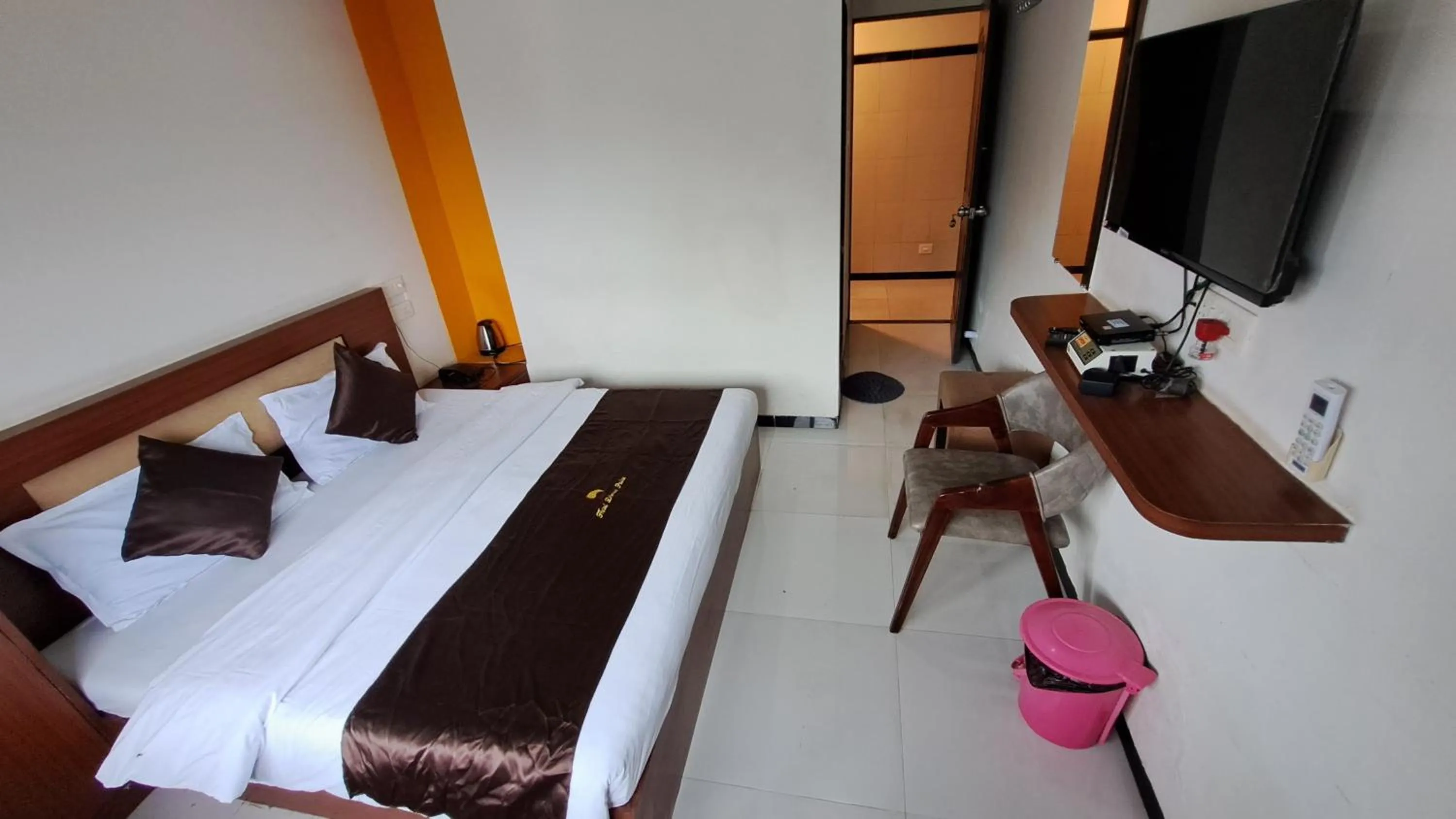 Bed in Hotel Dhruv Palace