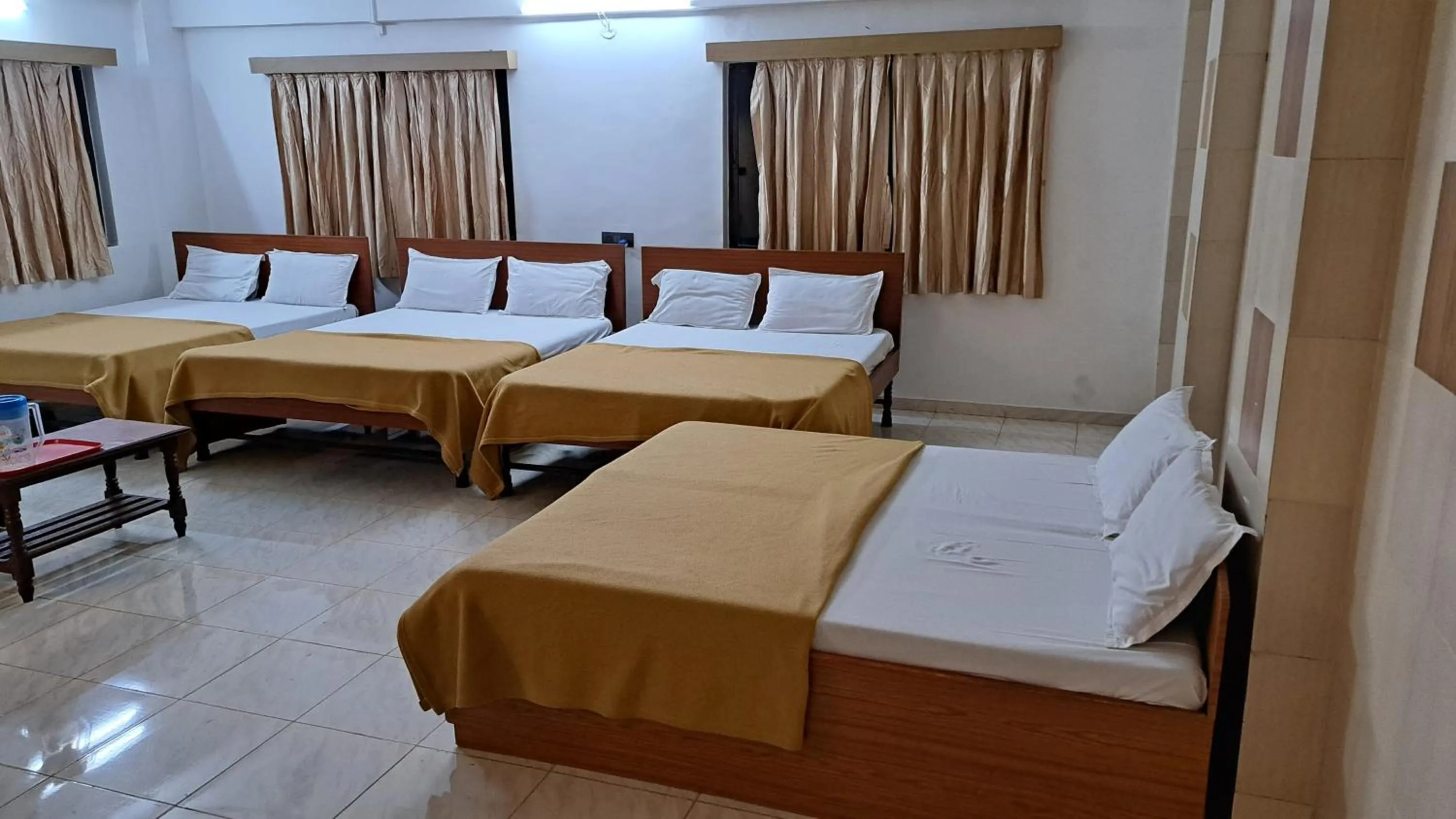 Bed in Hotel Dhruv Palace