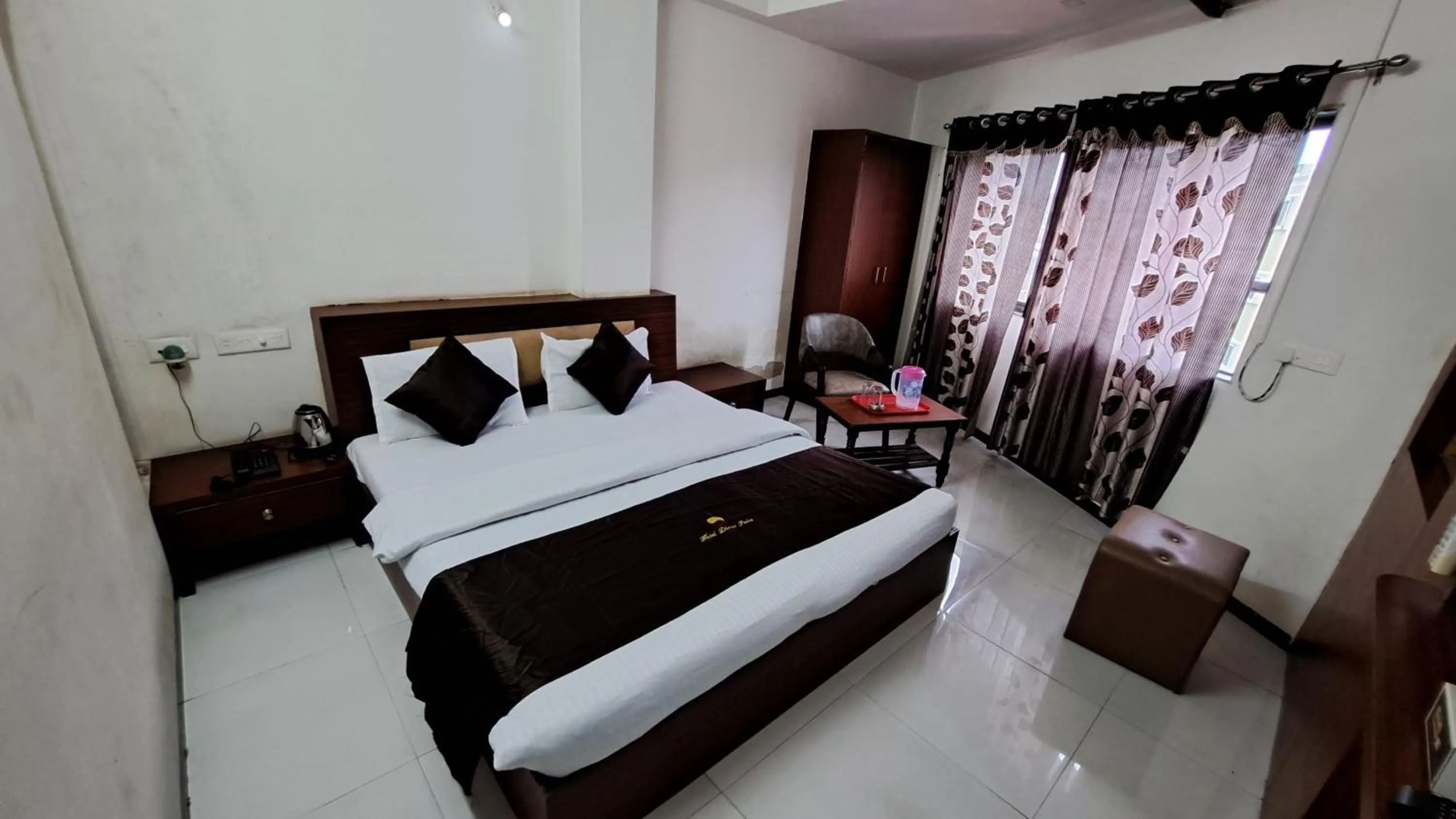 Bed in Hotel Dhruv Palace