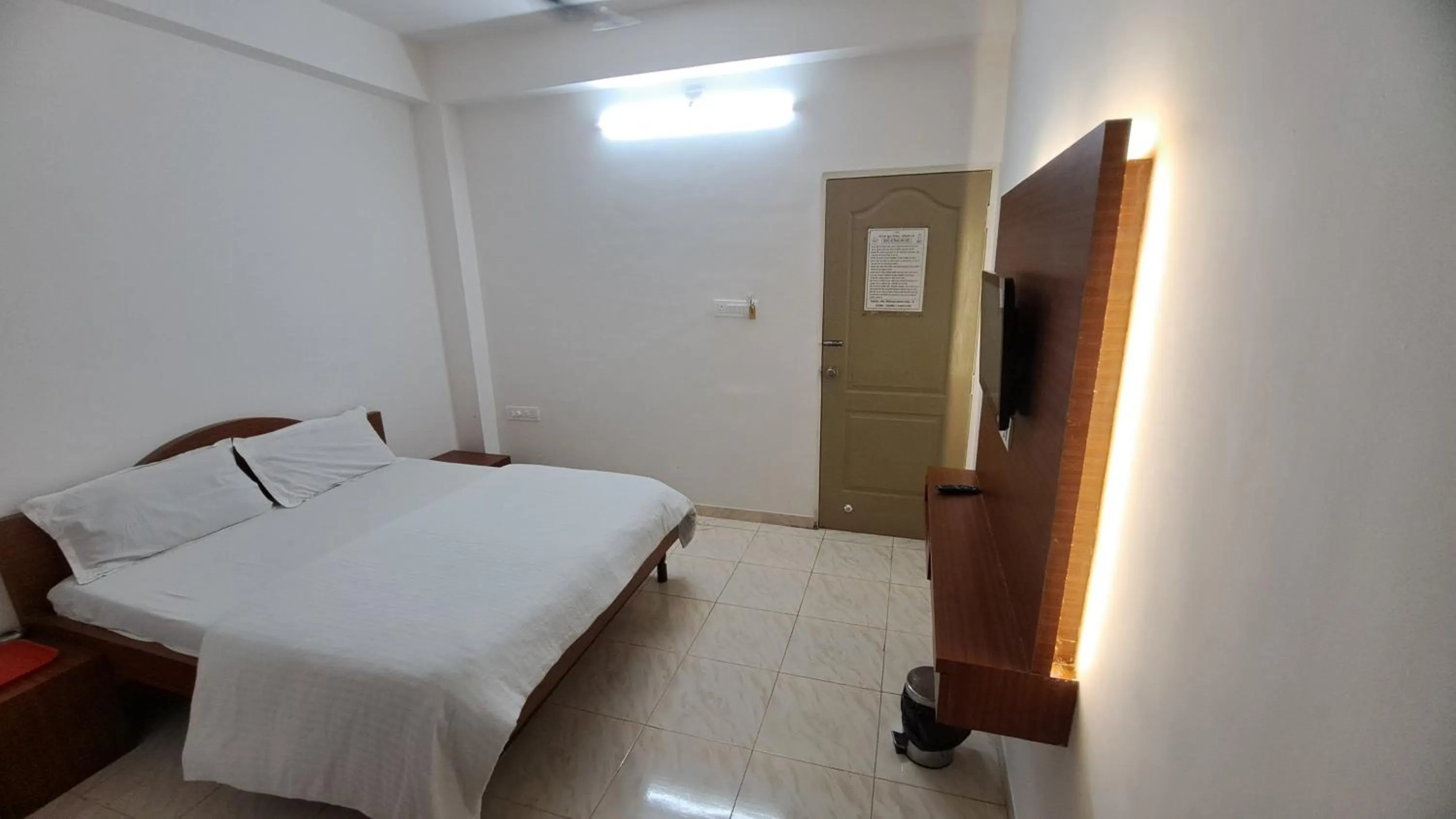 Bed in Hotel Dhruv Palace