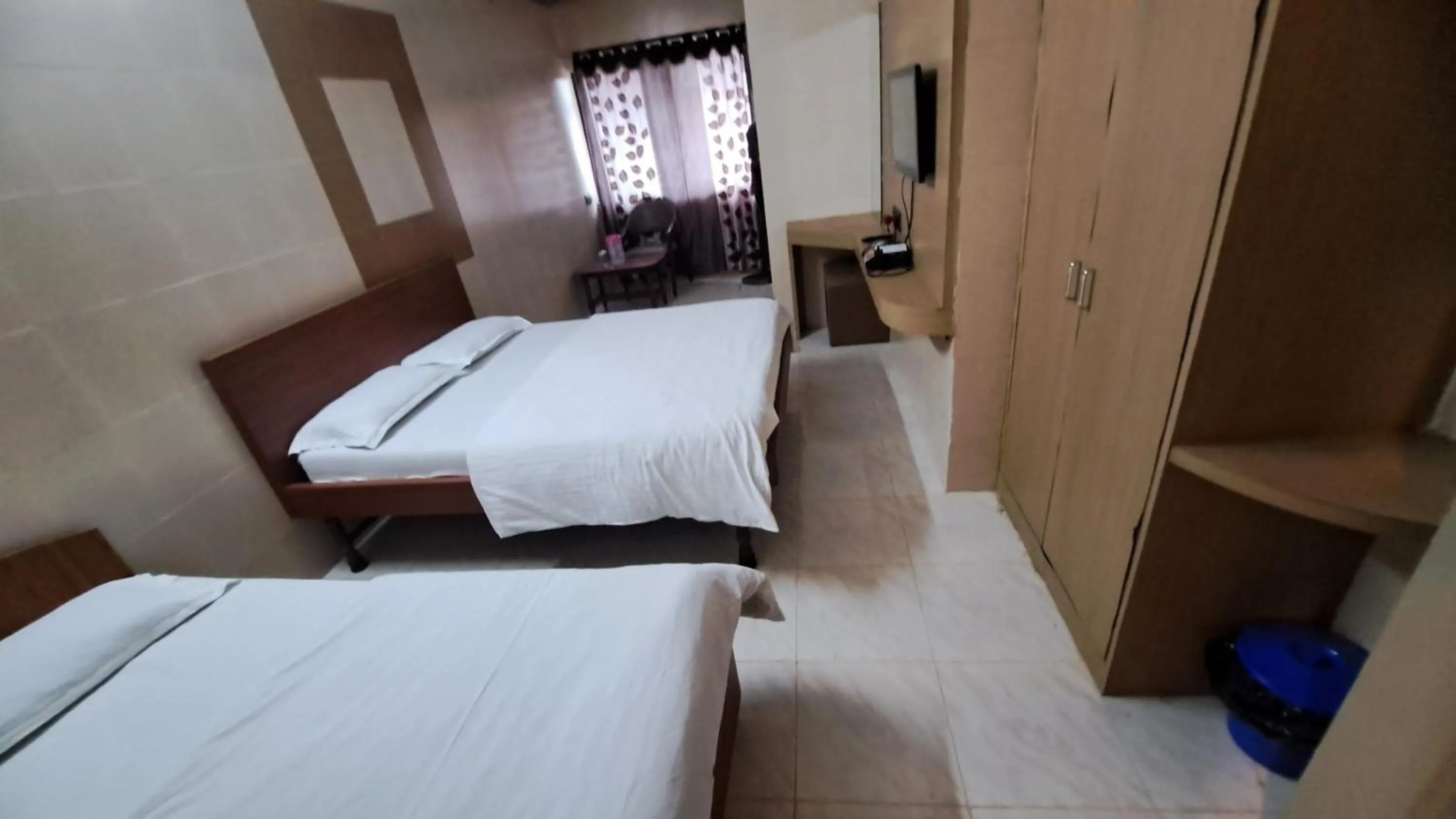 Bed in Hotel Dhruv Palace