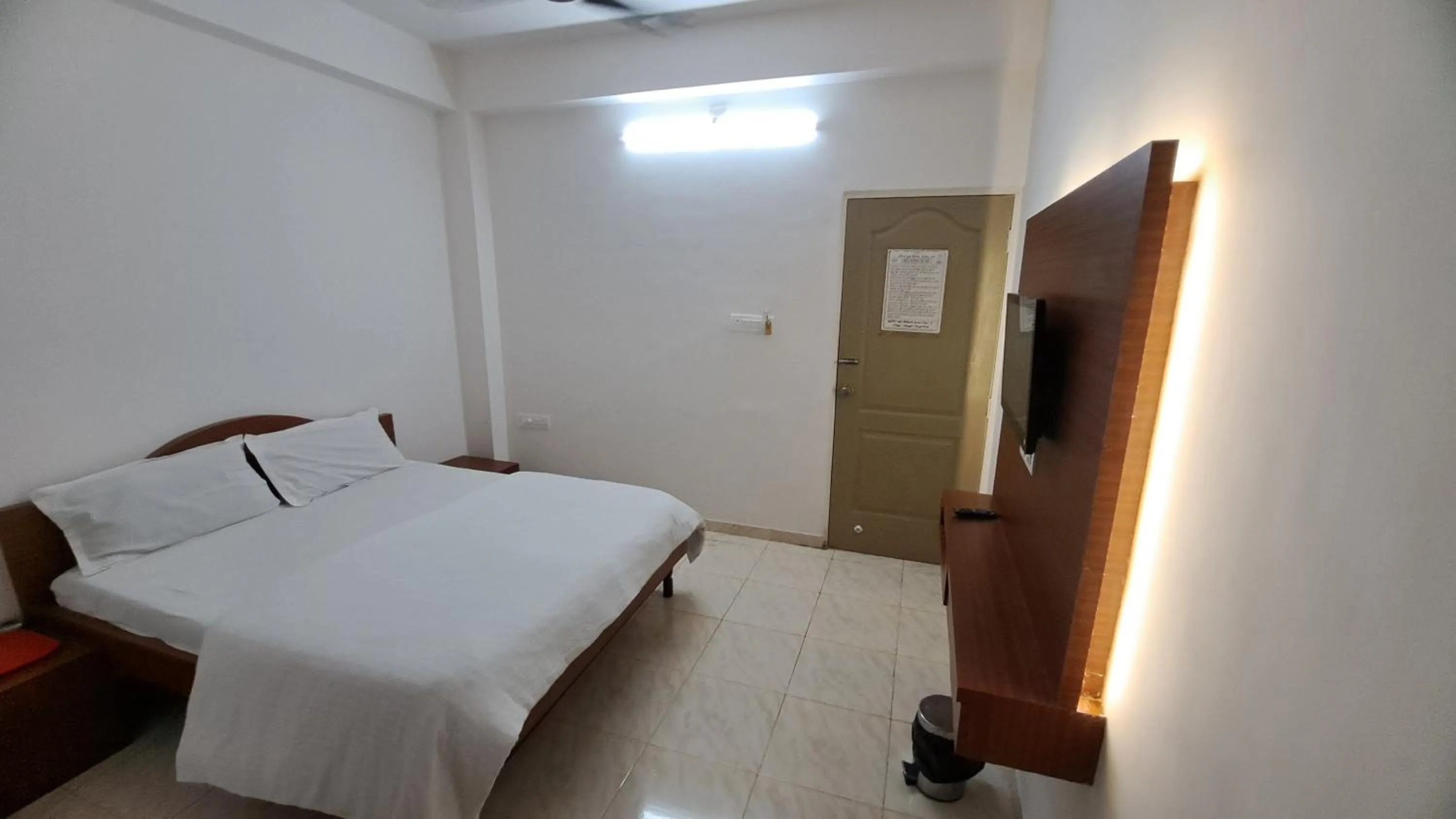 Bed in Hotel Dhruv Palace