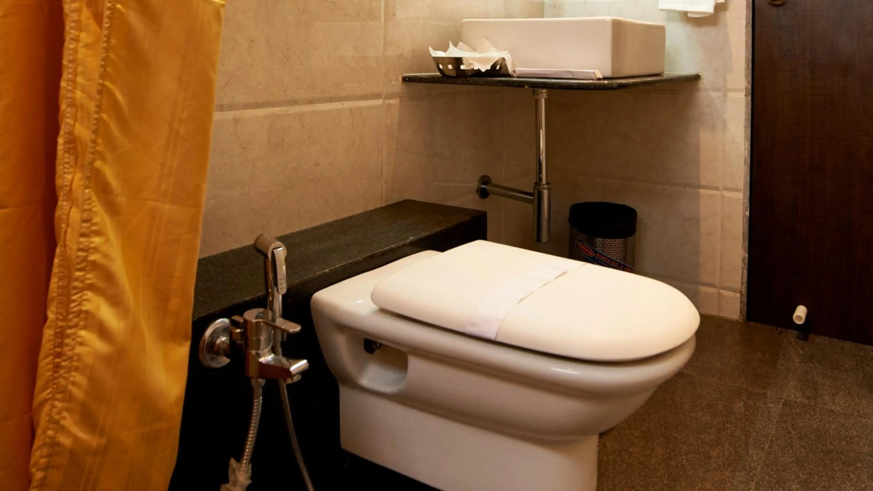 Bathroom in HOTEL SAI NISARG